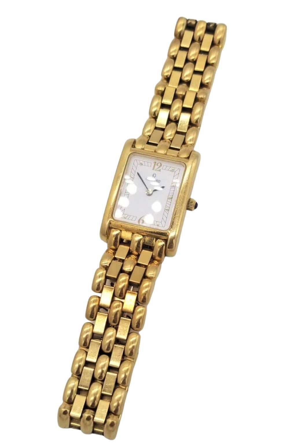 Concord Venetto 18K Gold Ladies Wristwatch with Concord Certifications and weighs 38.5 DWT. The 19mm by 21mm case houses a quartz movement, while the white dial features index markers. It comes on an 18K yellow gold link bracelet that measures 6.25