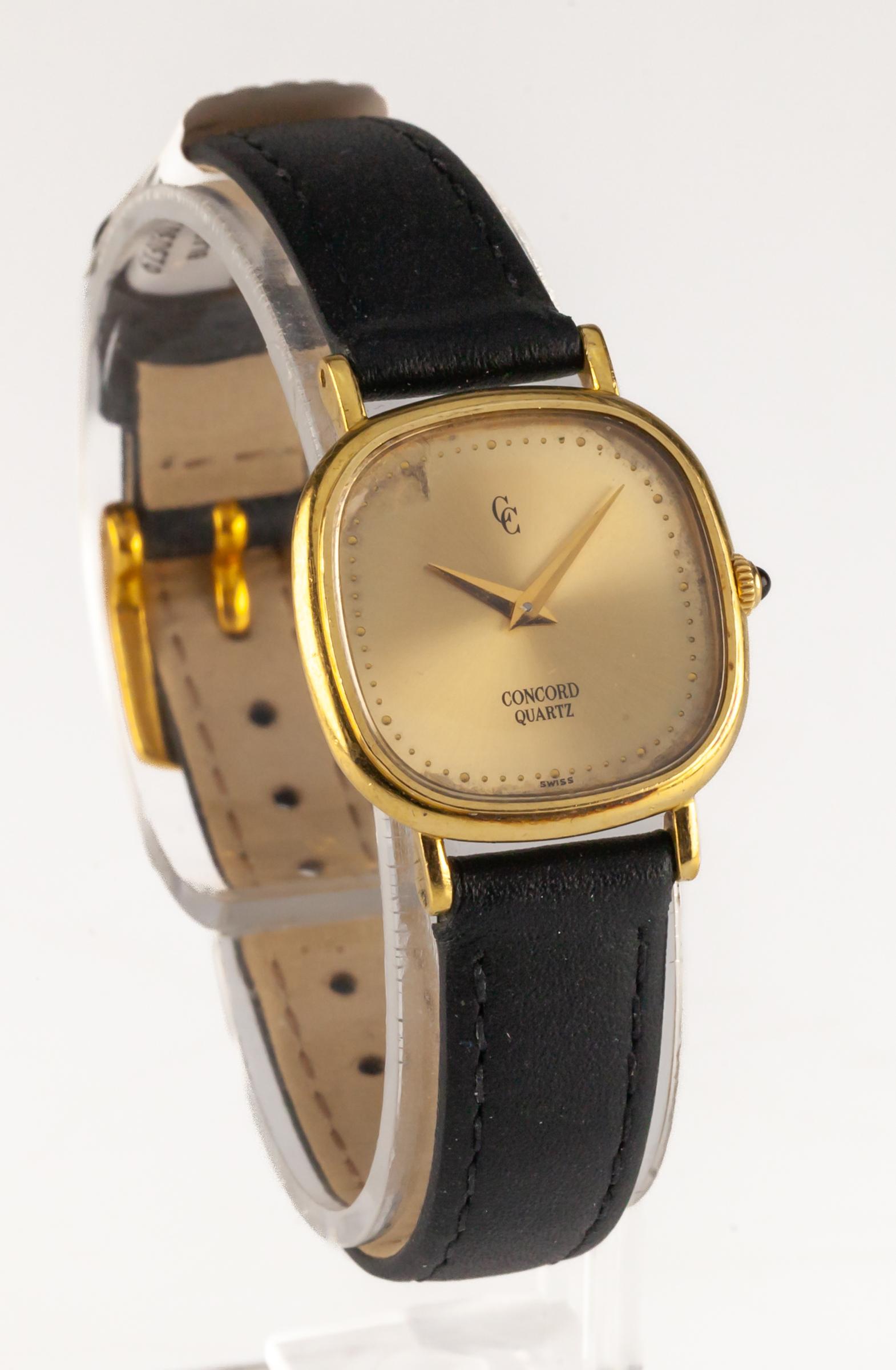 Concord Women's 18k Yellow Gold Quartz Watch w/ Leather Band

Movement #959001
Case #5081460
Serial #4840XX

18k Yellow Gold Rounded Square Case
22 mm Wide (25 mm w/ Sapphire Cabochon Crown)
23 mm Long
Lug-to-Lug Distance = 29 mm
Lug-to-Lug Width =