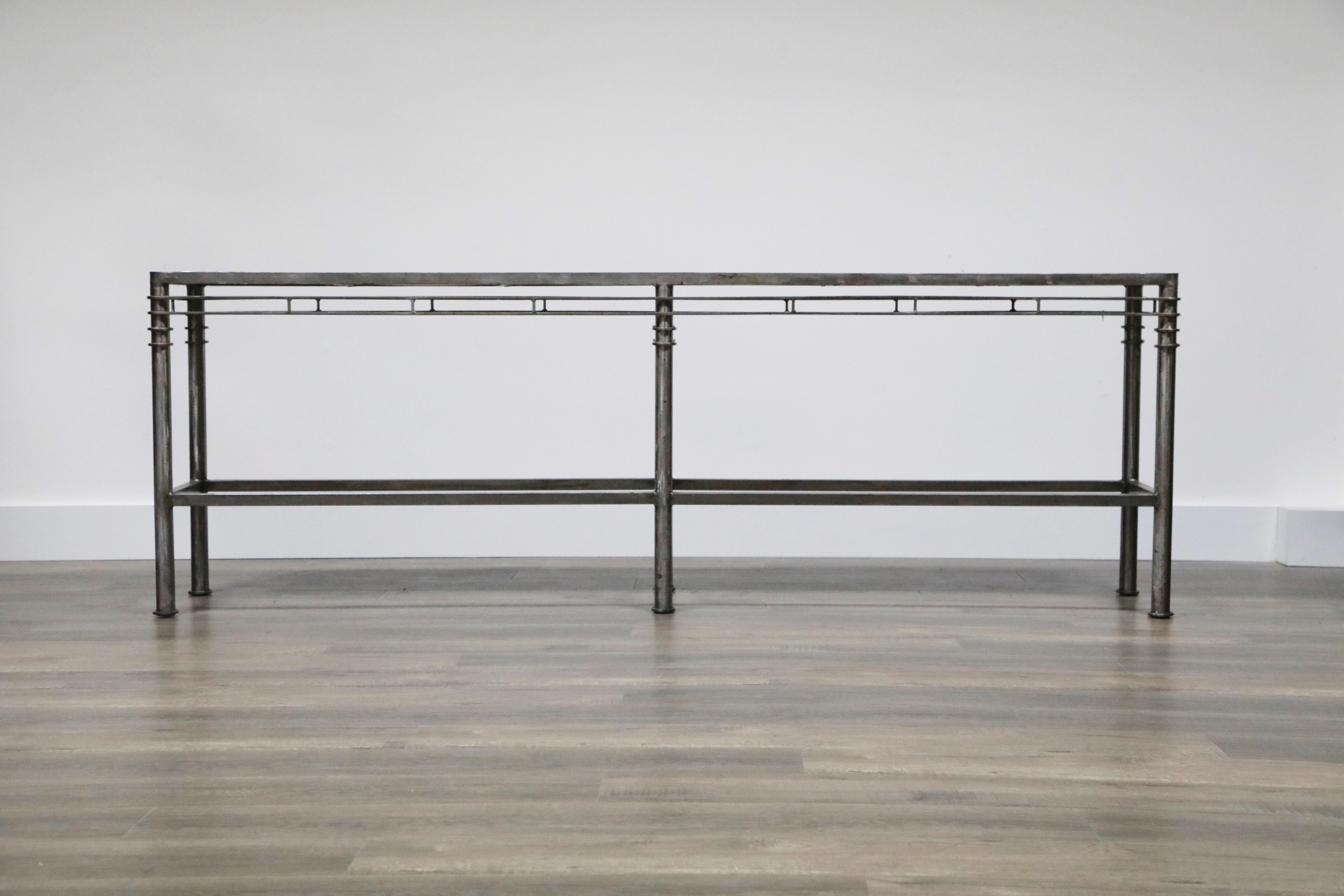 A fantastic concrete and brushed steel console / sofa table in the style of Ilana Goor. We also have the matching coffee / cocktail table, listed separately, as shown in the last photo. 

This hefty console table is very high quality and has