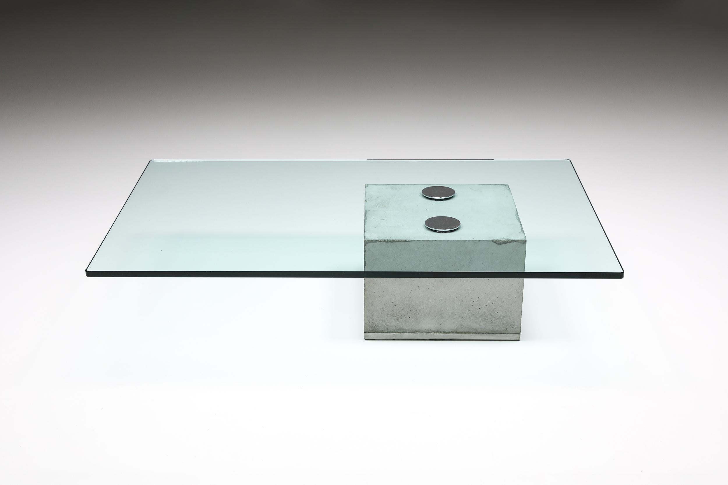 Italian design; 1970's; Saporiti; Coffee table;

Elegant minimalist SAPO coffee table by Saporiti.
The raw concrete block supports a glass top secured by two polished chrome knobs to create a sleek coffee table.