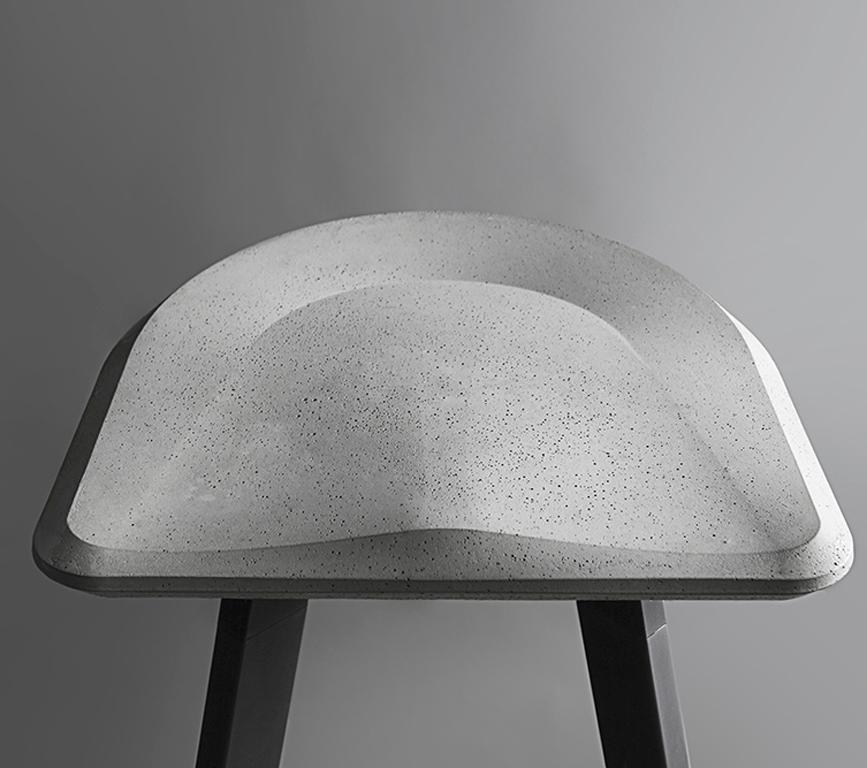 Material: Concrete, demolition leftover concrete and powder-coated steel
Size: 465 x 465 x H 765 mm
Weight: 11 kg
Seat color: Cement grey
Accessory color: Black

About the artist/ designer:
Bentu's furniture derives its uniqueness from the