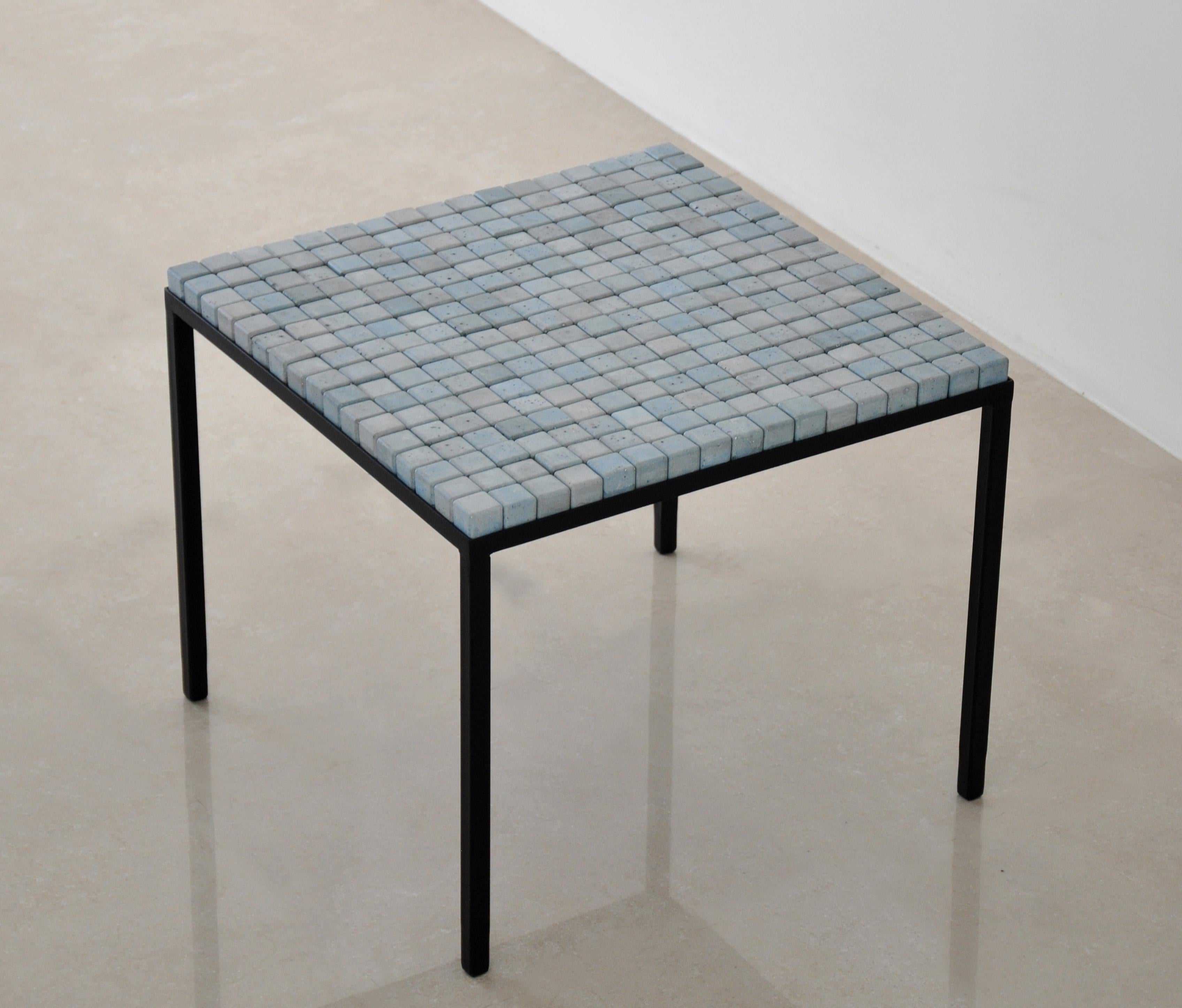 Concrete blue cube table by Miriam Loellmann
Edition of 10
Signed
Materials: colored concrete, steel (hand painted), leather
Dimensions: 56.5 x 56.5 x 56.5 cm
Weight: 22 kg 

Cubes are removable, each table-top is unique, one of a kind and