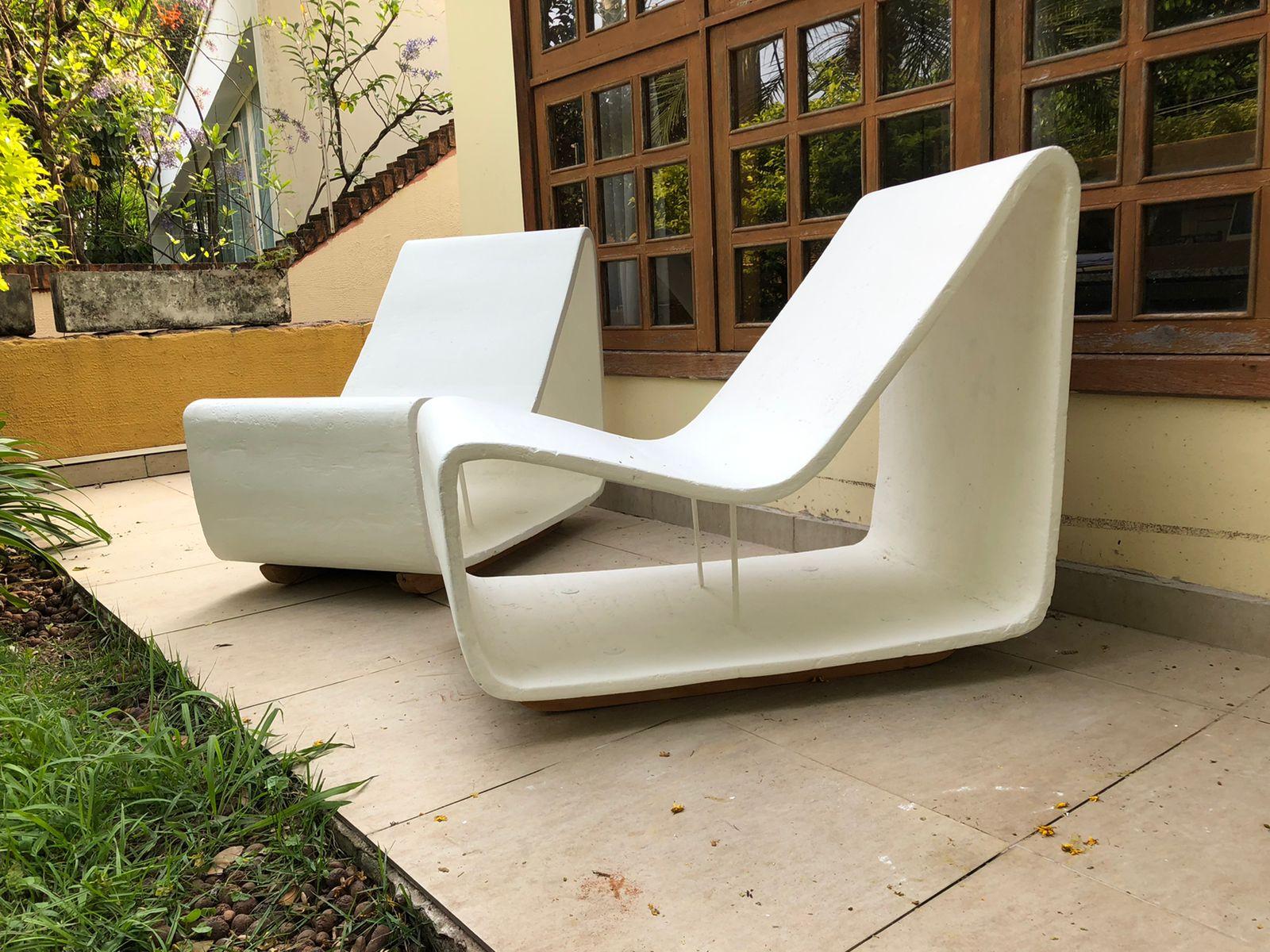 Pair of concrete chair designed & signed by Willy Guhl for Eternit. The chairs are a bigger version of the classic Loop Chair and keeps the loop shape characteristics, featuring a single volume of seats and backs. 
The chairs are suitable for