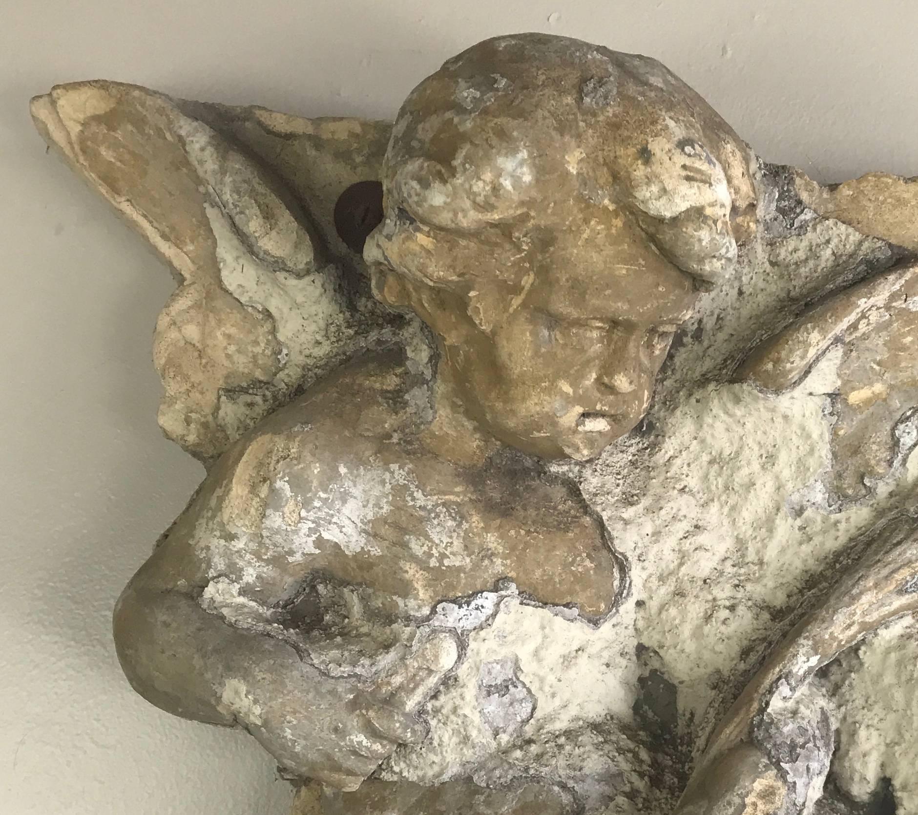 1930's carved Concrete Cherub wall hanging with remnants of gesso throughout.
Diagonal 33