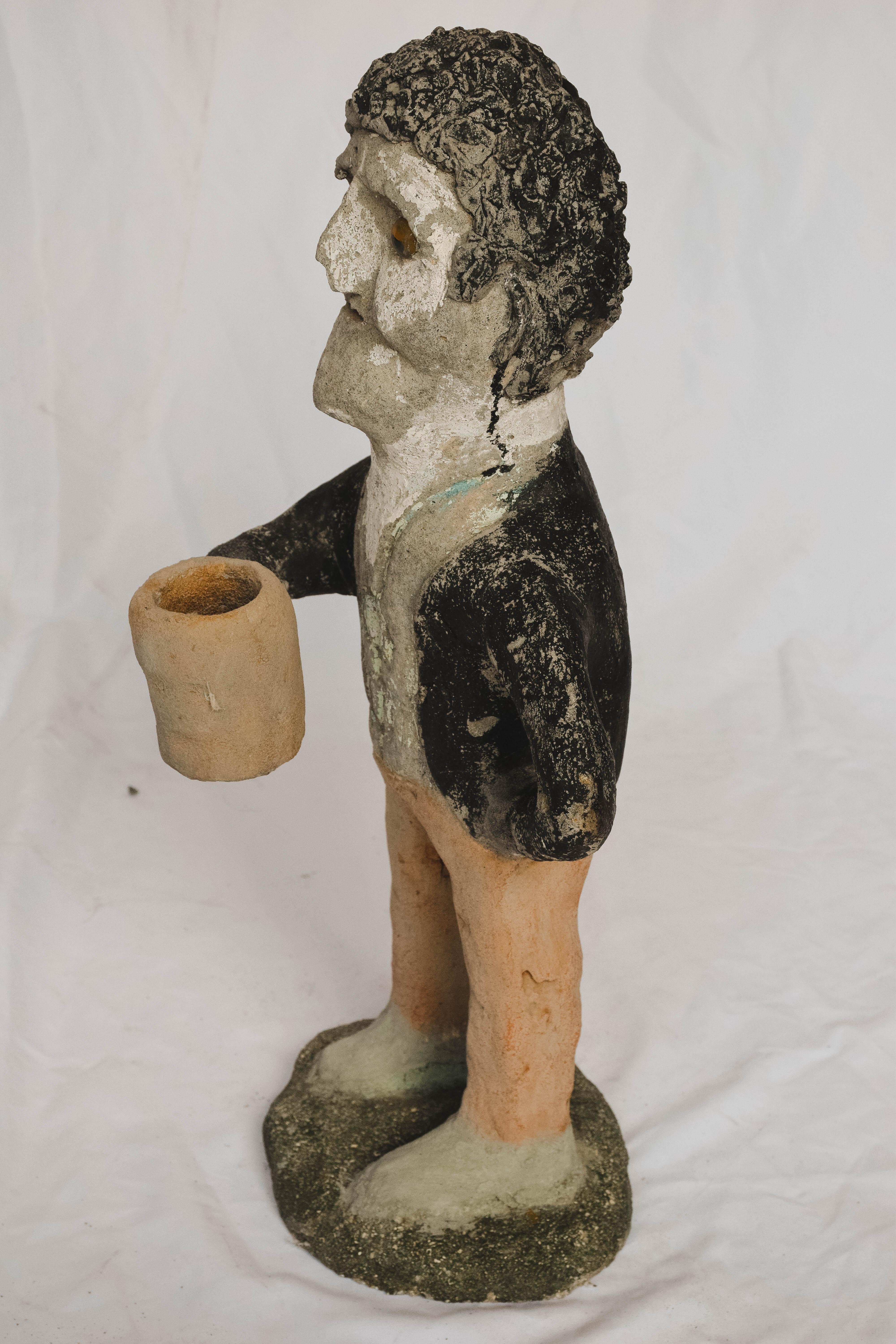 We love this concrete drinking man. The artist hand-sculpted the man adding paint and marble eyes to his art. A wonderful conversation piece for your garden, bar, man cave or kitchen. 

This piece weighs 20 lbs.