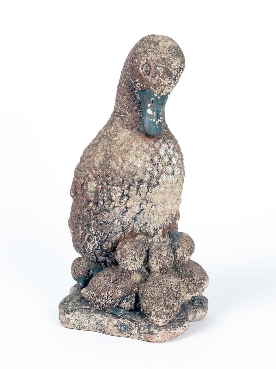 Capture the enchantment of a vintage French garden with this charming duck family ornament. Crafted from durable concrete, it stands as a testament to both artistry and timelessness. The honest patina adorning the surface tells a tale of weathered