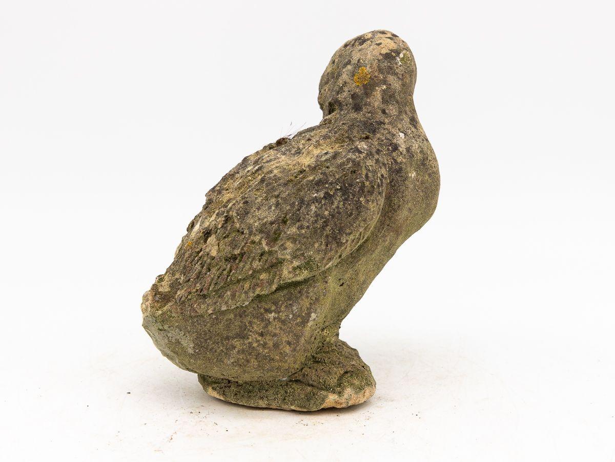 Capture the enchantment of a vintage French garden with this charming duck ornament. Crafted from durable concrete, it stands as a testament to both artistry and timelessness. The honest patina adorning the surface tells a tale of weathered beauty,