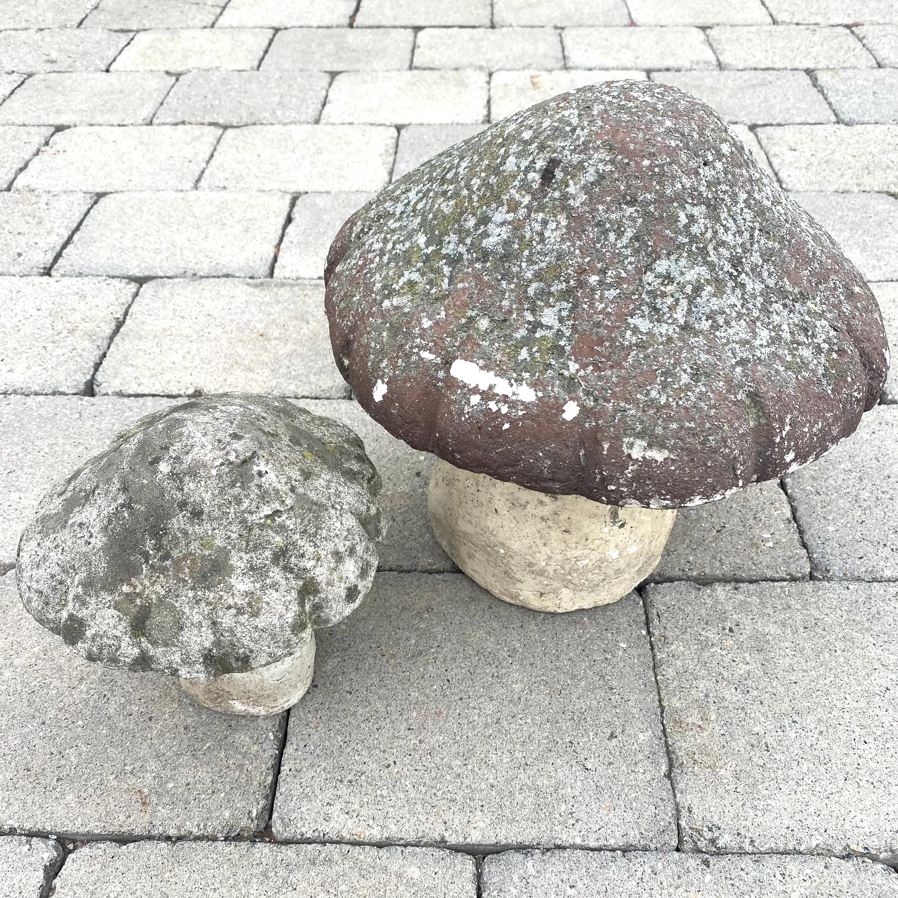 Stunning French concrete garden mushrooms, circa 1970s. Great for use outside. Age has given these unique items a beautiful patina. Extremely substantial and well made, these decorative mushrooms are constructed of solid concrete with painted caps.
