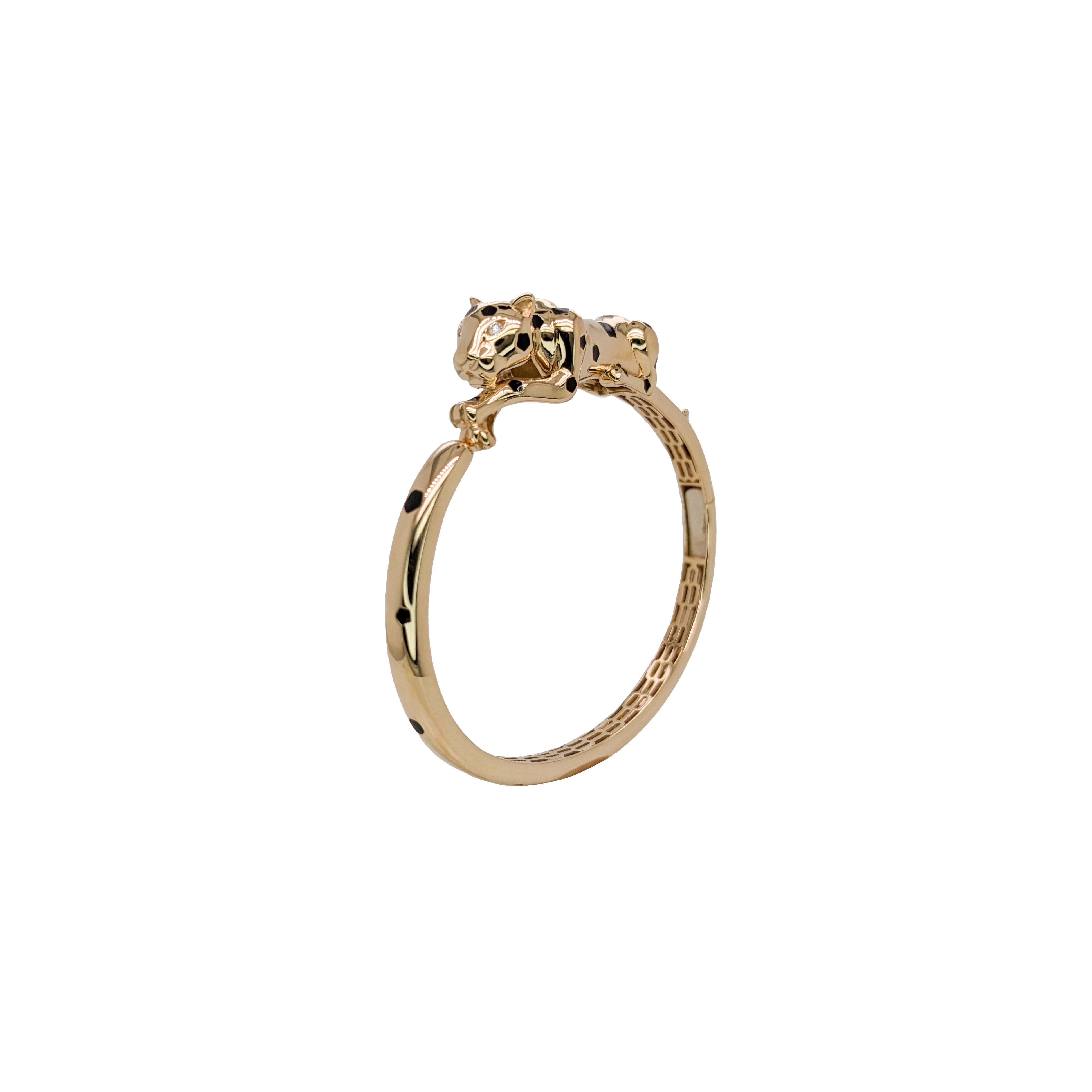 Rawr! This chunky solid 14k yellow gold leopard bangle with black enamel spots and glittering earth-mined diamond eyes is your ticket to bold, wild style. Perfectly fierce as a cheetah or panther bangle—because the concrete jungle needs a
