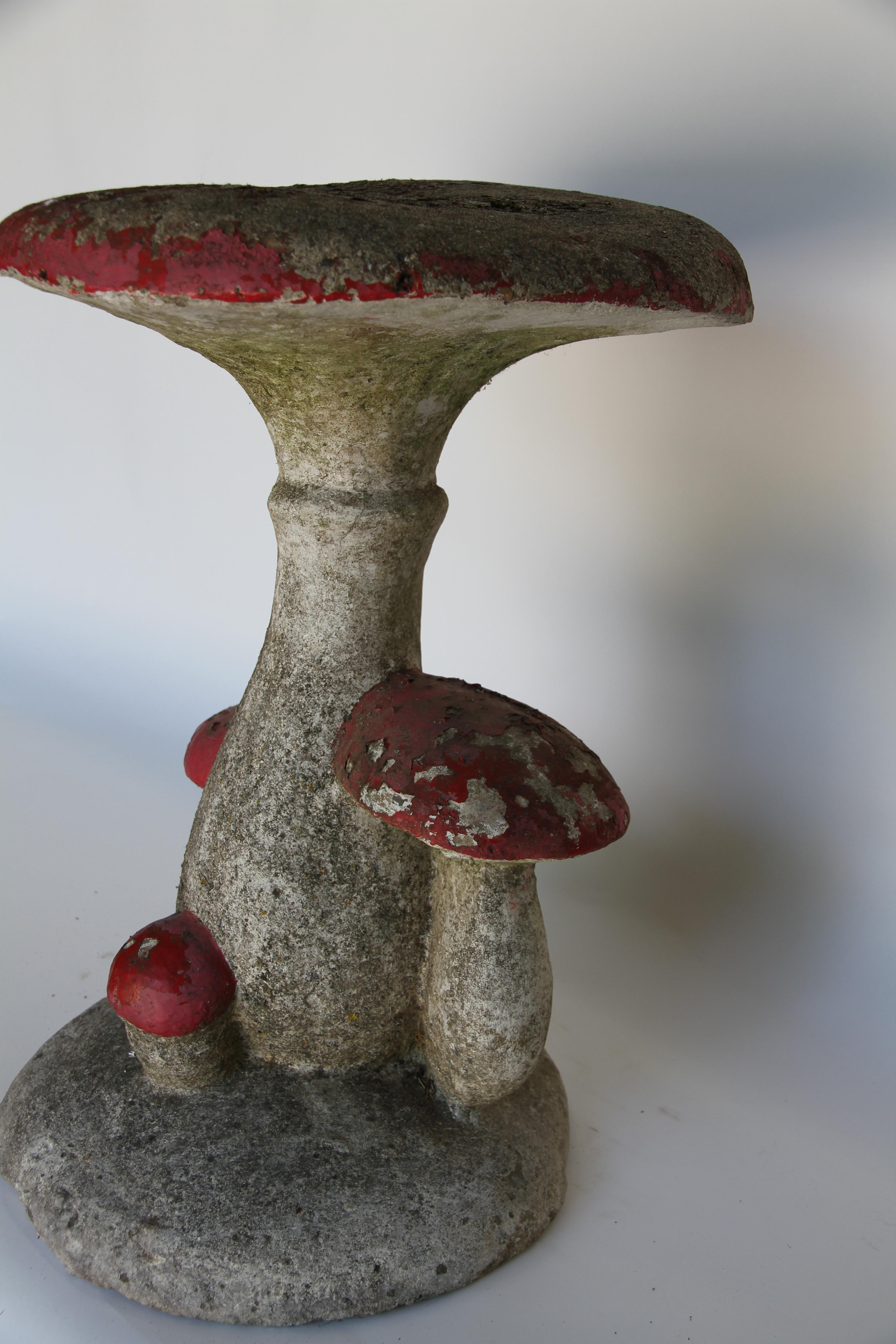 Found in France, this cement cluster of mushrooms serves well as a whimsical garden element or could be used as an unique end table.