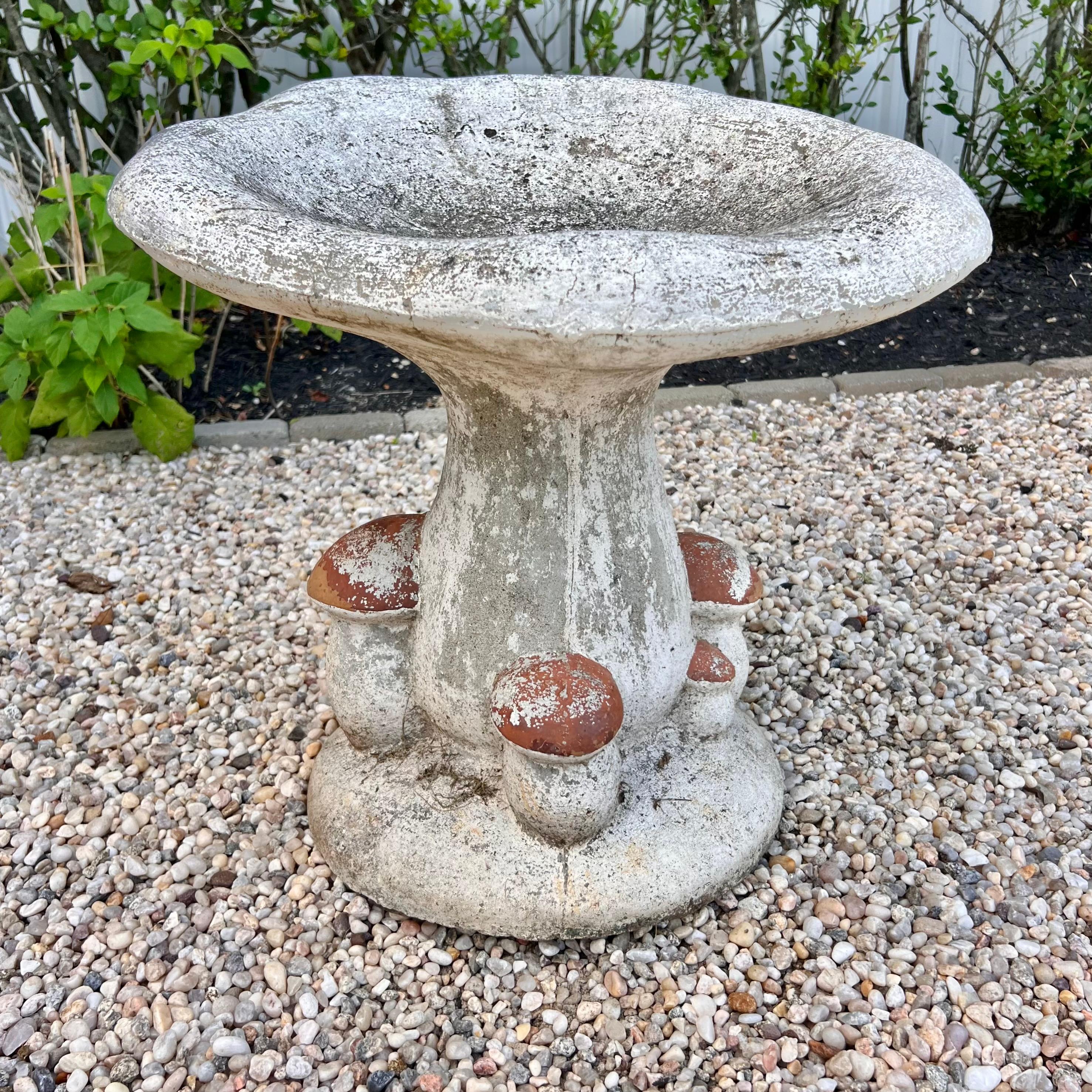 Stunning French concrete mushroom stools from the 1950s. All hand made and hand painted featuring small decorative mushrooms along the base. This statement piece would look fabulous in a garden or on a patio. Gorgeous patina. Extremely heavy and