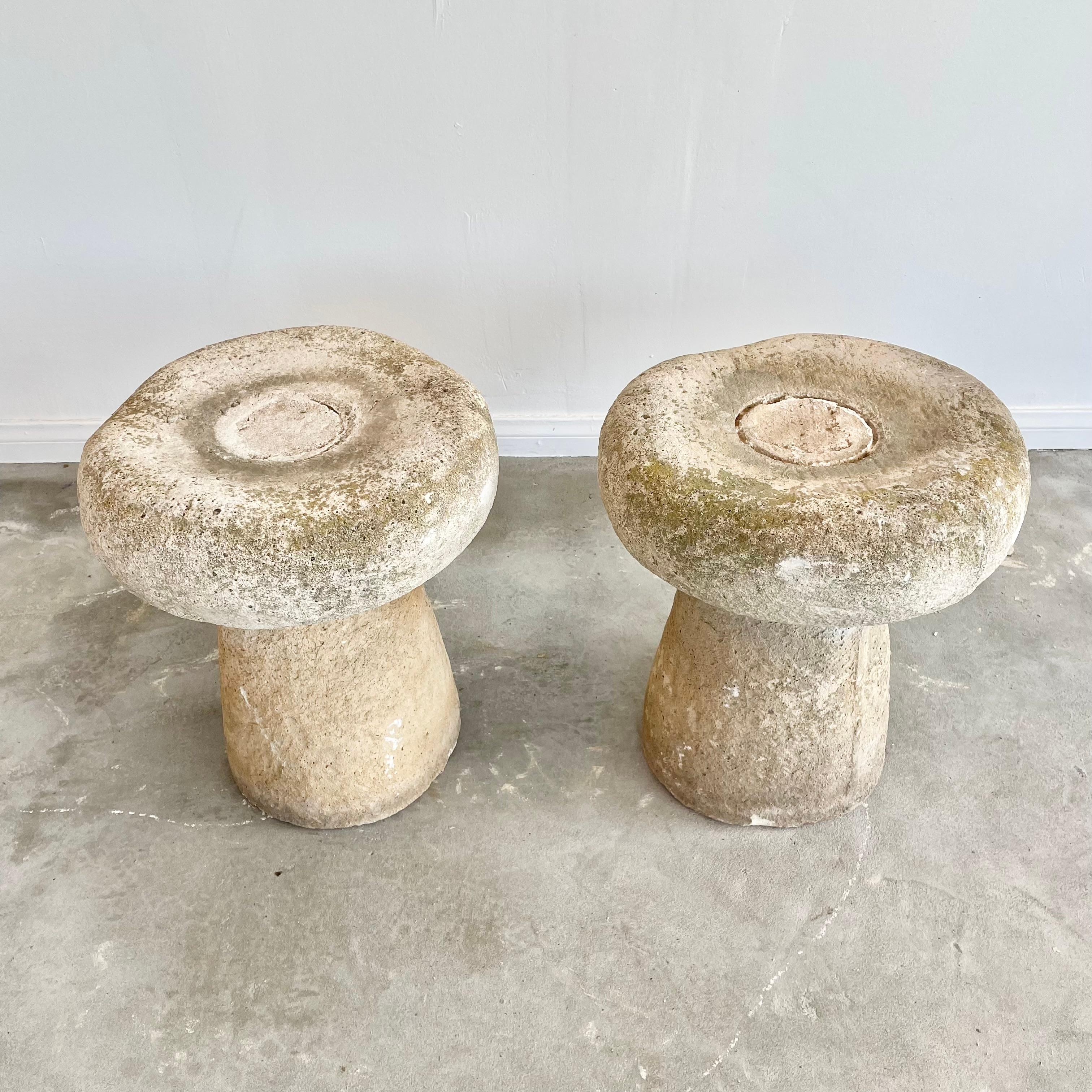 Stunning French concrete mushroom stools, circa 1970s. Fun and unique design with a concrete base resembling a mushroom stem and a concrete seat which resembles a mushroom cap. Great for outdoor or indoor use. Light wear and patina gives each seat a