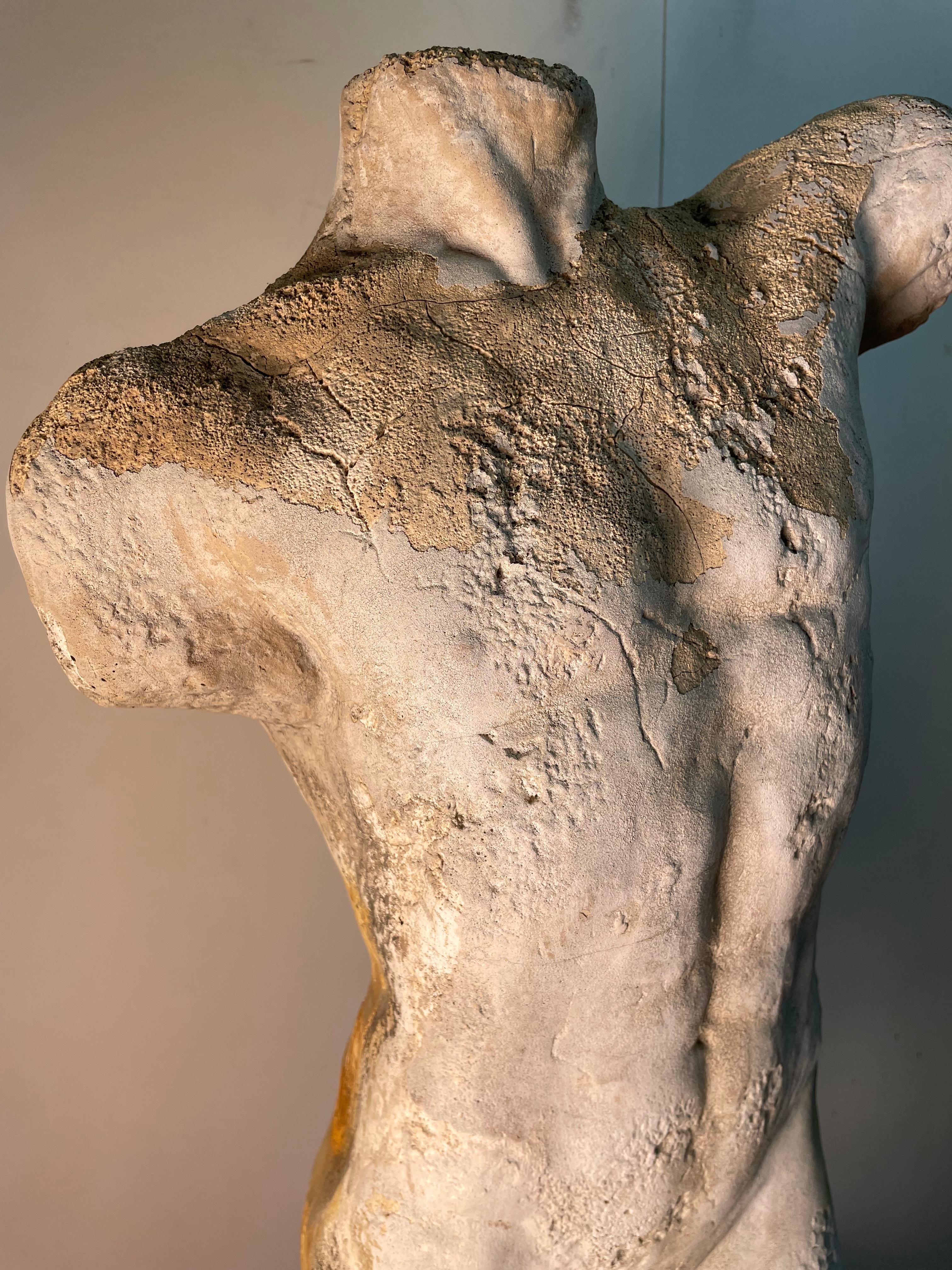 Concrete Naked Sculpture of a male figure made in the 19th century. The ware and tear on the statue gives it an angelic look, yet gives us a reminder of the mortality of man. The cracks in the sculpture can reflect the cracks we all gain throughout