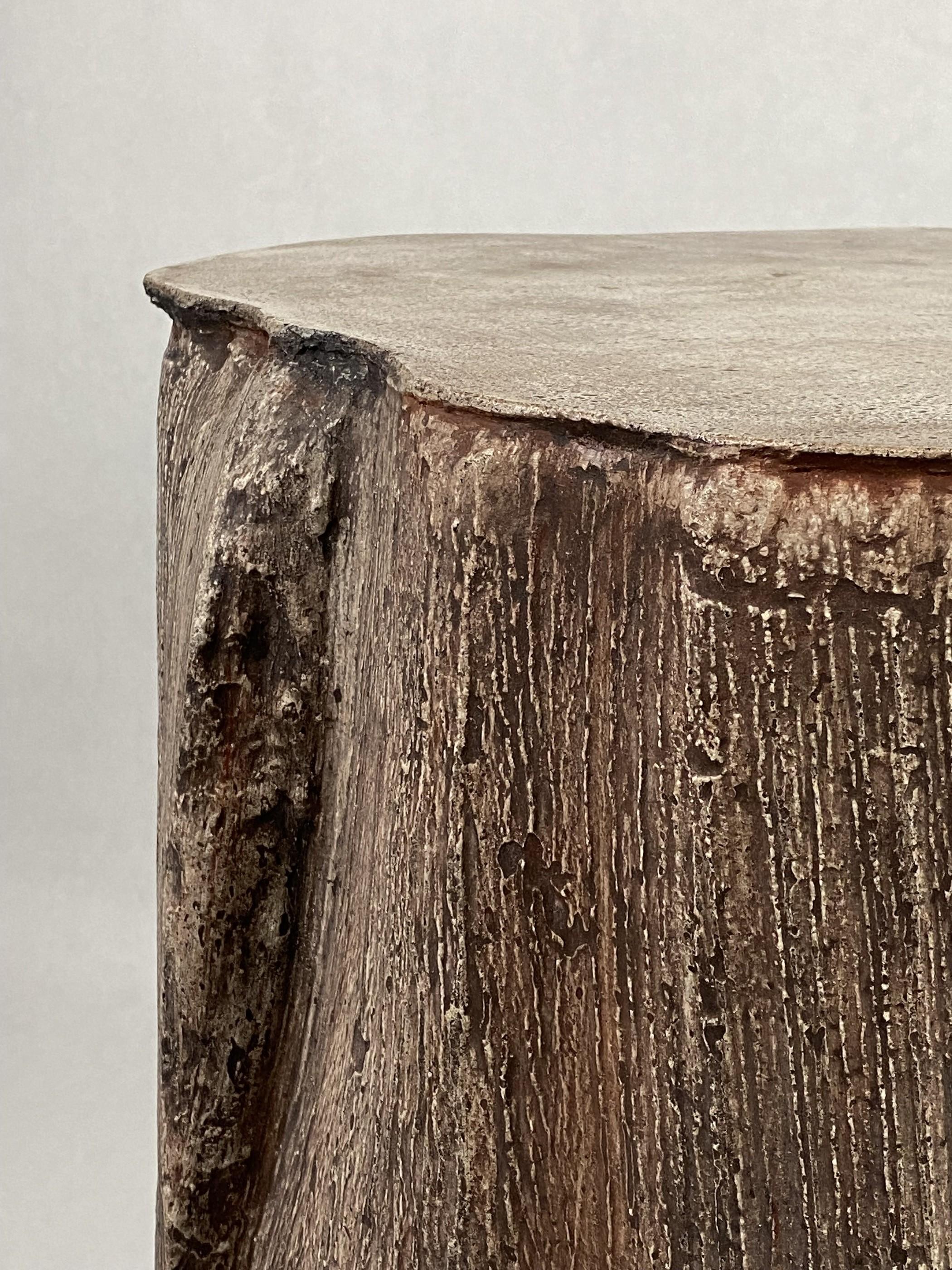 This contemporary, organic concrete Palm table takes its form from stitched-together pieces of palm tree seedpods. Its somewhat faux bois texture, prominent but not rough, calls out for a dance of the fingers, with crevices a climber would dream of.