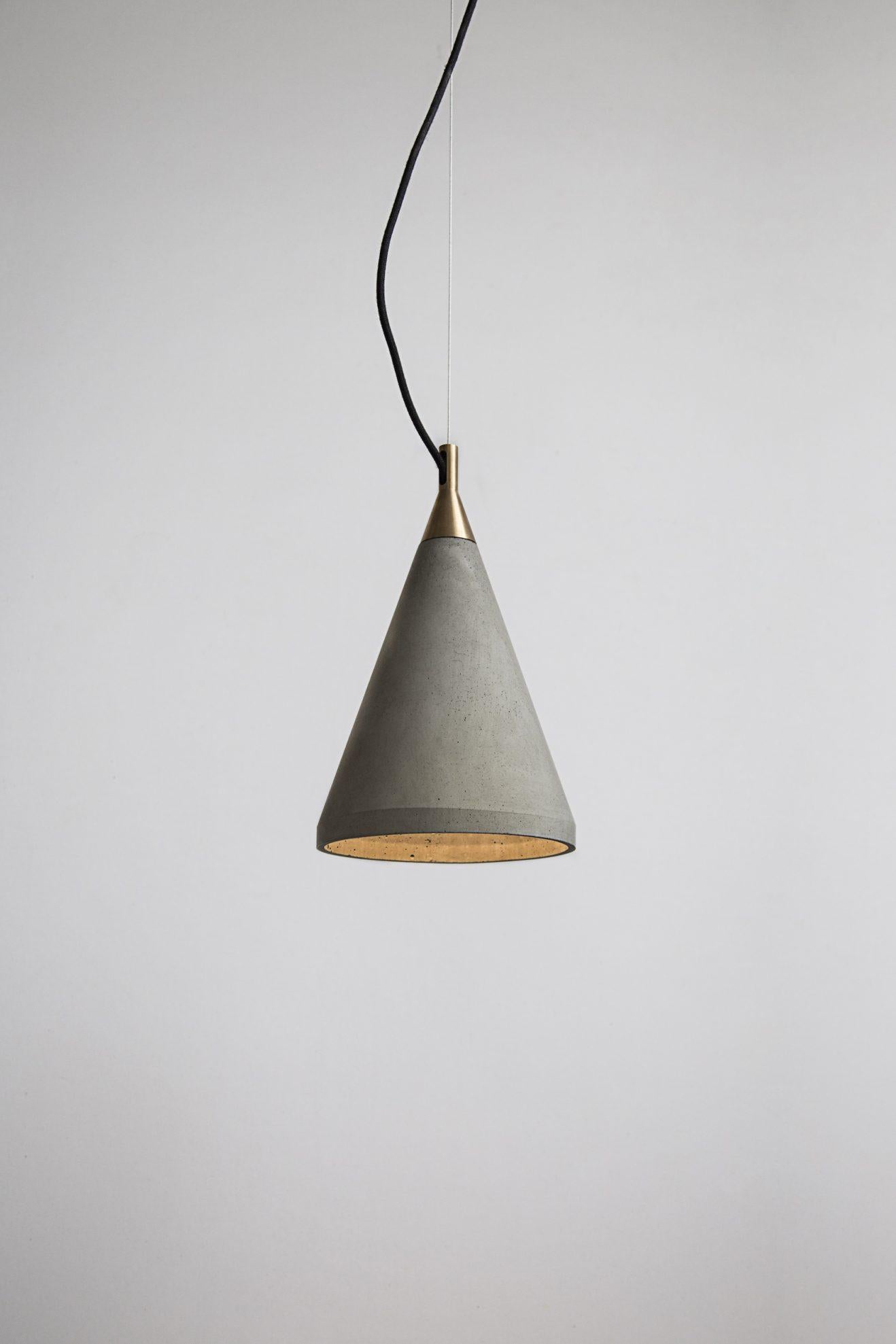 Ren 1
Concrete ceiling lamp designed by Cantonese studio Bentu Design

31.7 cm High; 20.2 cm Diameter
Concrete
Black wire 2m adjustable. 
Bulb: E27 LED 7W 100-240V 80Ra 700LM 3400K

These pendant lamps are available in 3 different dimensions with