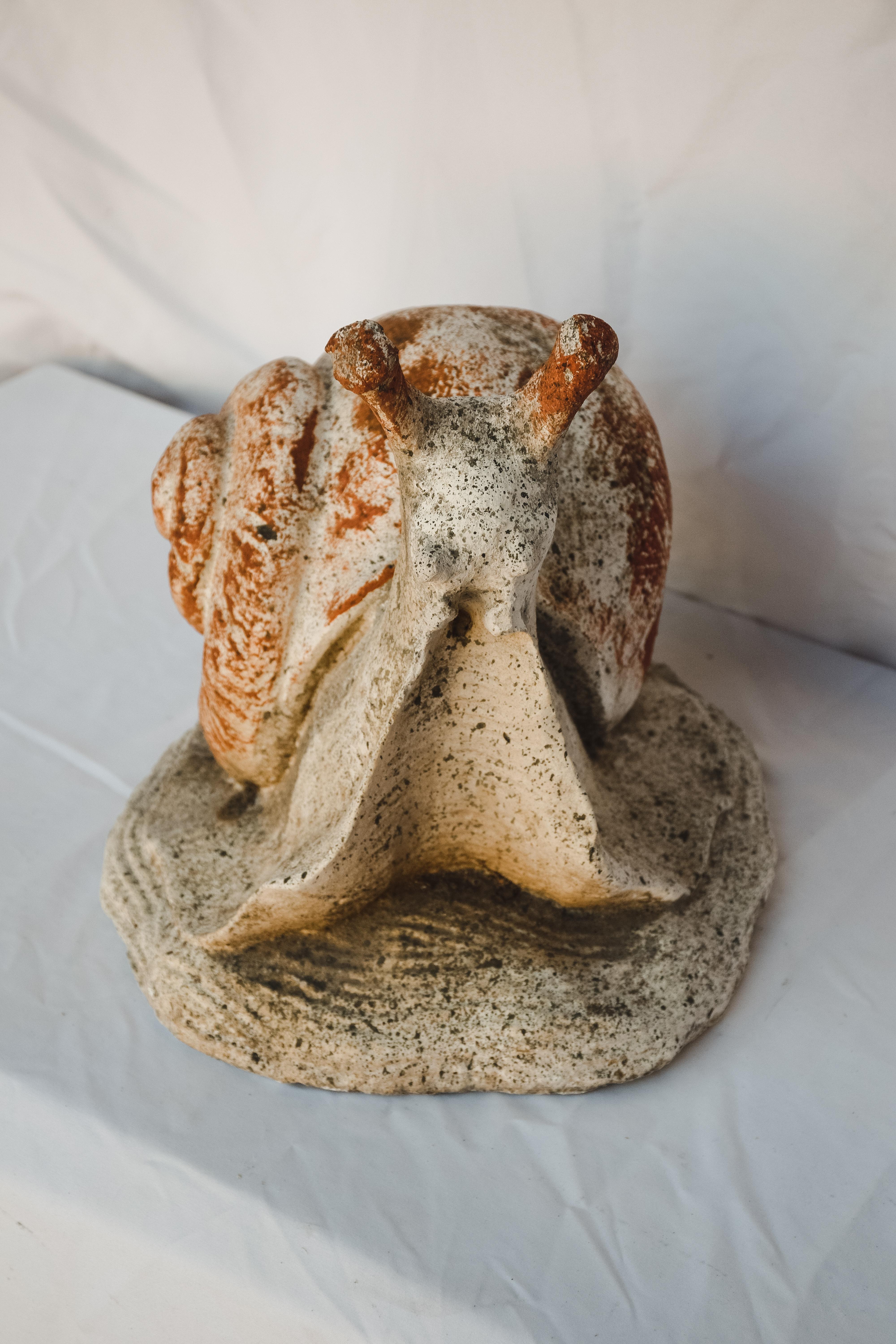 Mid-20th Century Concrete Garden Snail. This garden element has an amazing time worn patina. Could be placed on a patio or in the garden. But honestly so incredible indoors. Great Conversations piece.