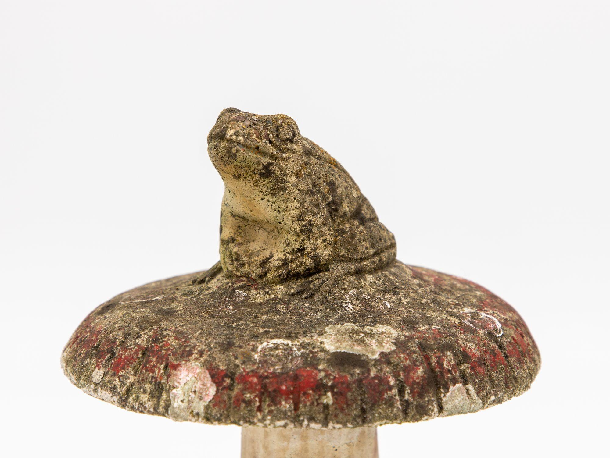 This charming cast stone toad garden ornament adds a touch of whimsy and delight to your outdoor decor. This ornament features a lifelike toad sitting on a toadstool, crafted with intricate details and a realistic expression, and retains some of its