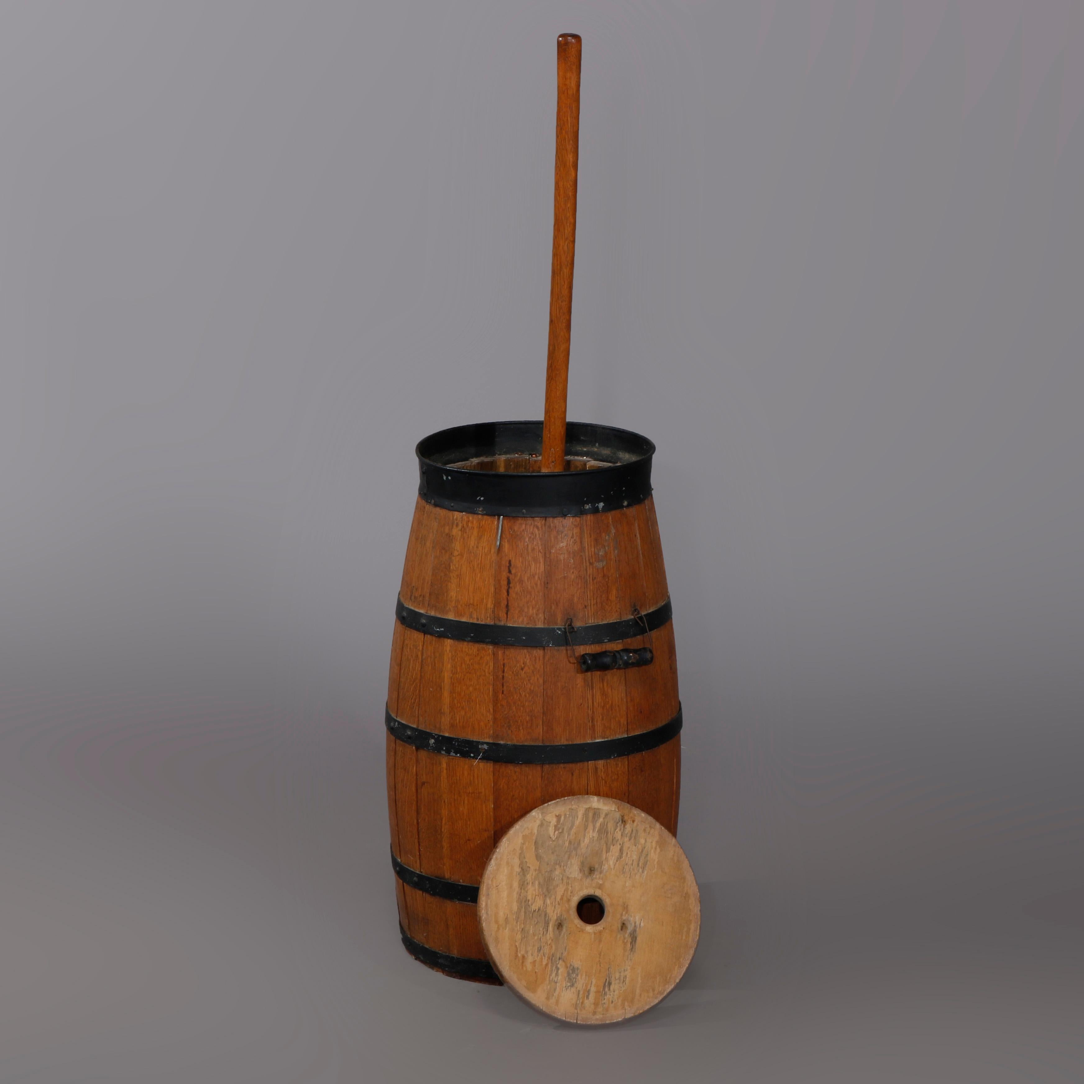 An antique Primitive butter churn offers oak construction with metal banding straps and handles, 19th century
Oak butter churn, 19th century

Measures- 42.25