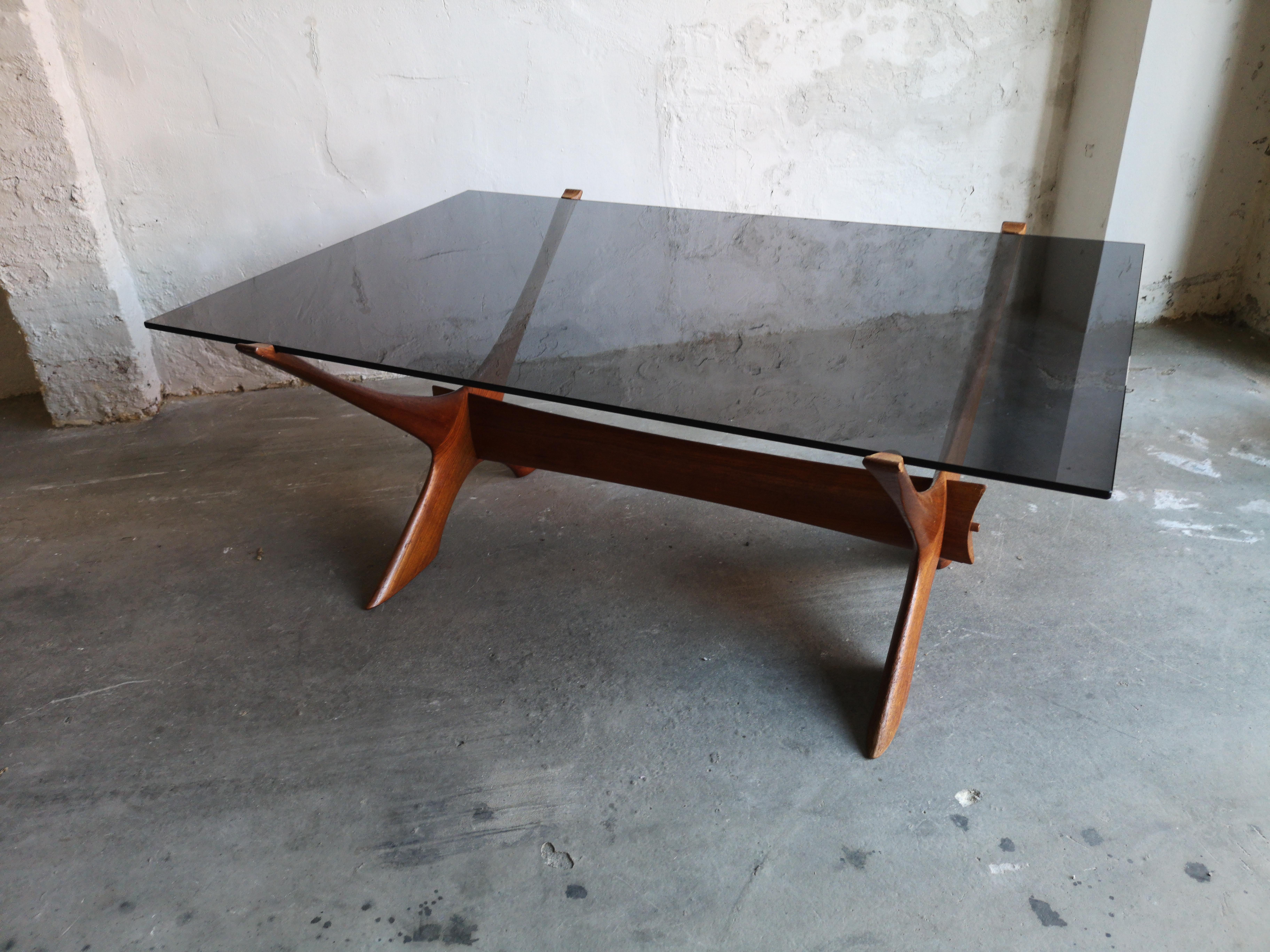 This stunning teak and glass coffee table was Designed by Fredrik Schriever-Abeln for O¨rebro Glasfabrik in Sweden in the 1960's. The teak frame is in very good vintage condition with some signs of use as expected for a 50 year old table. 

The