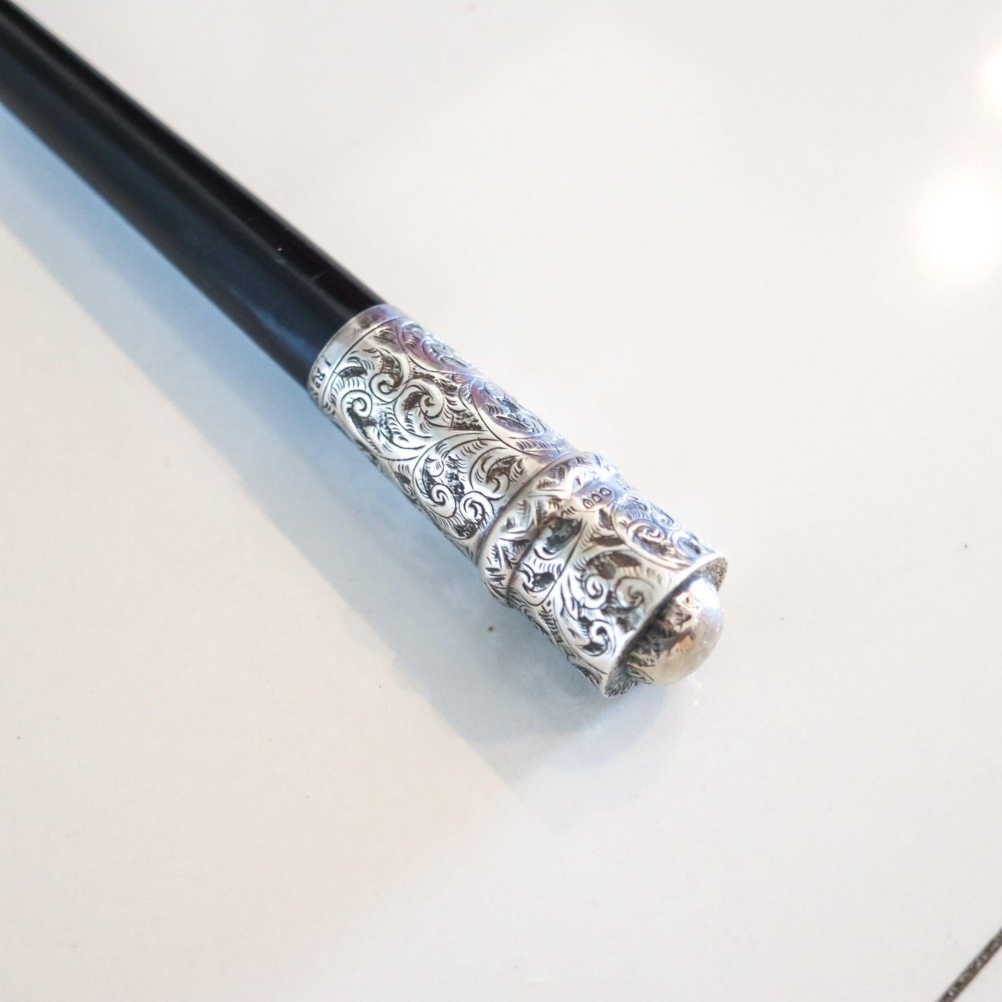 Conductor's baton from the Victorian period.

This is a very interesting and elusive antique director's baton created in Devonshire England during the Victorian period, back in 1890. The luxurious baton is crafted in ebonized wood with parts crafted