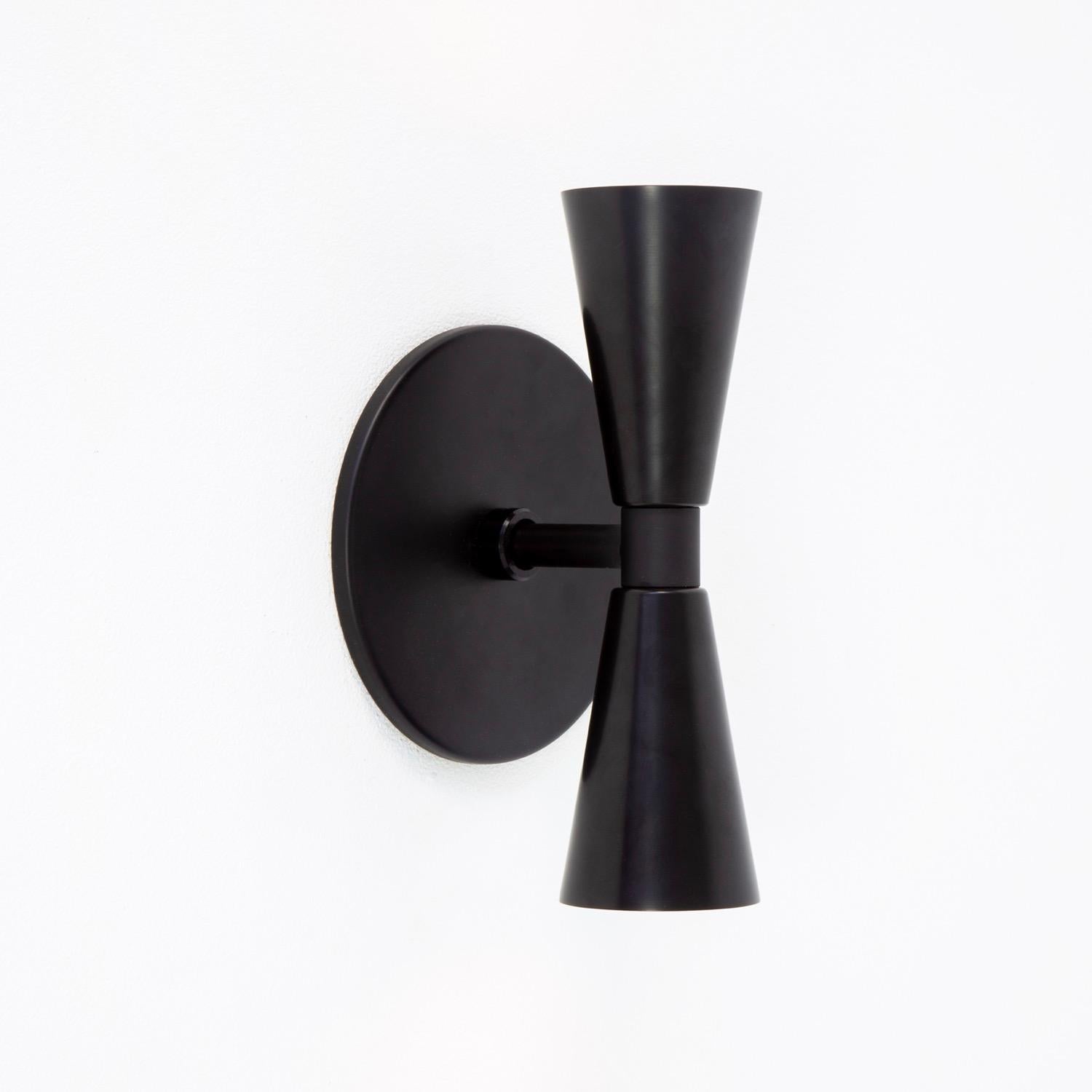 This listing is for 1x Cone 2 Sconce in black manufactured by Research.Lighting.

Materials: Brass, Steel
Finish: Black
Electronics: 2x G8 Sockets, 2x 4.5 Watt LED Bulbs (included), 900 Lumens total
UL Listed. Made in the USA.