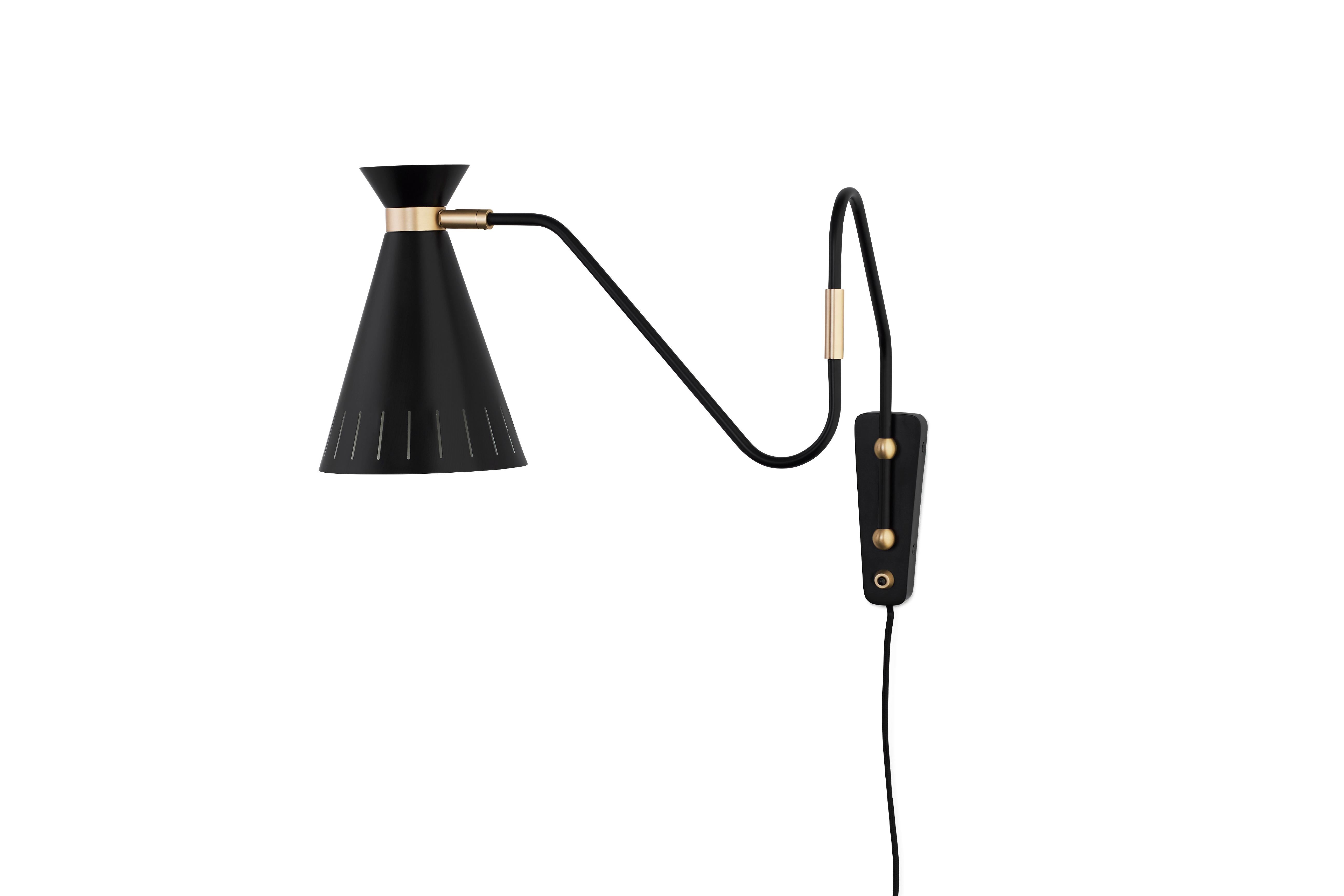 Cone Black Noir Wall Lamp by Warm Nordic
Dimensions: D16 x W63 x H30 cm
Material: Lacquered steel, Solid brass
Weight: 1 kg
Also available in different colours. Please contact us.

A classic wall light with charm and finesse designed in the