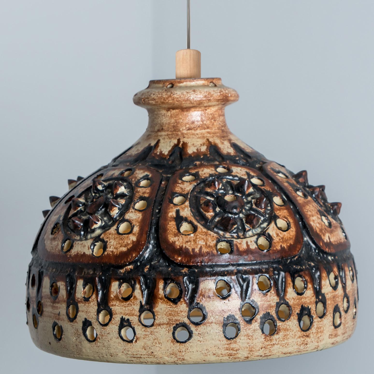 Stunning round hanging lamp with an cone-like shape, made with rich chocolate colored brown ceramics, manufactured in the 1970s in Denmark. We also have a multitude of unique colored ceramic light sets and arrangements, all available in the