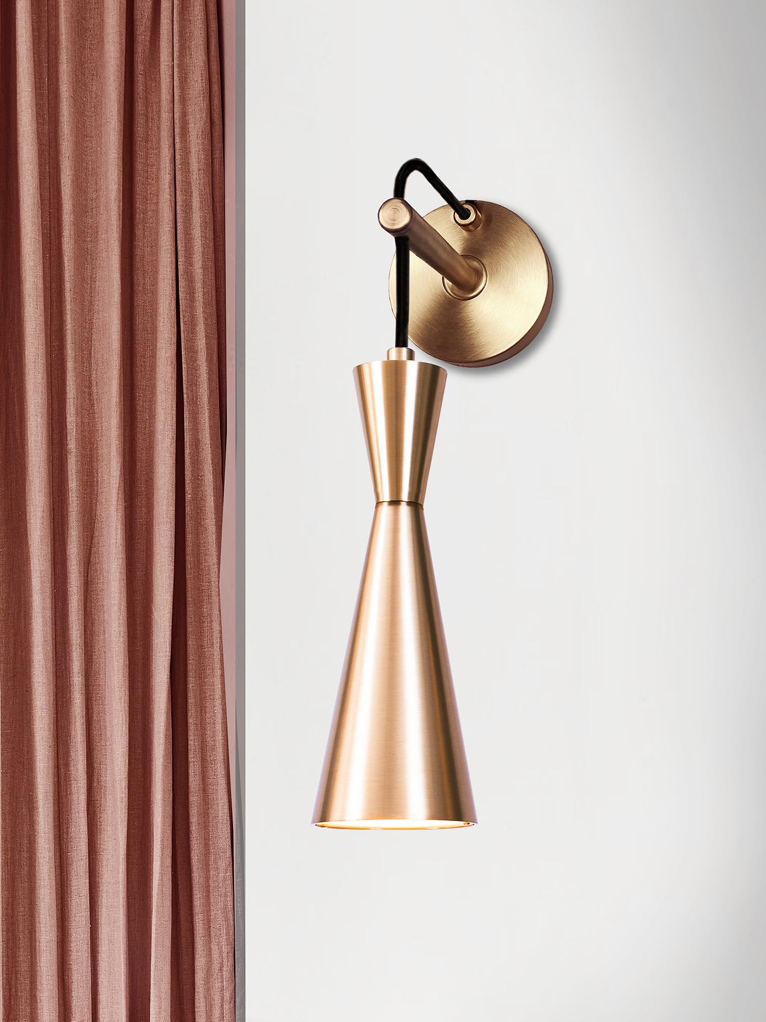 Cone is designed to showcase the beauty and timeless elegance of geometrical symmetry. Each cone is machined from a solid block of brass.

Size: H 48cm (18.9in) x W 30cm (11.8in) x D 35cm (13.8in)
GU10 LED Bulb.