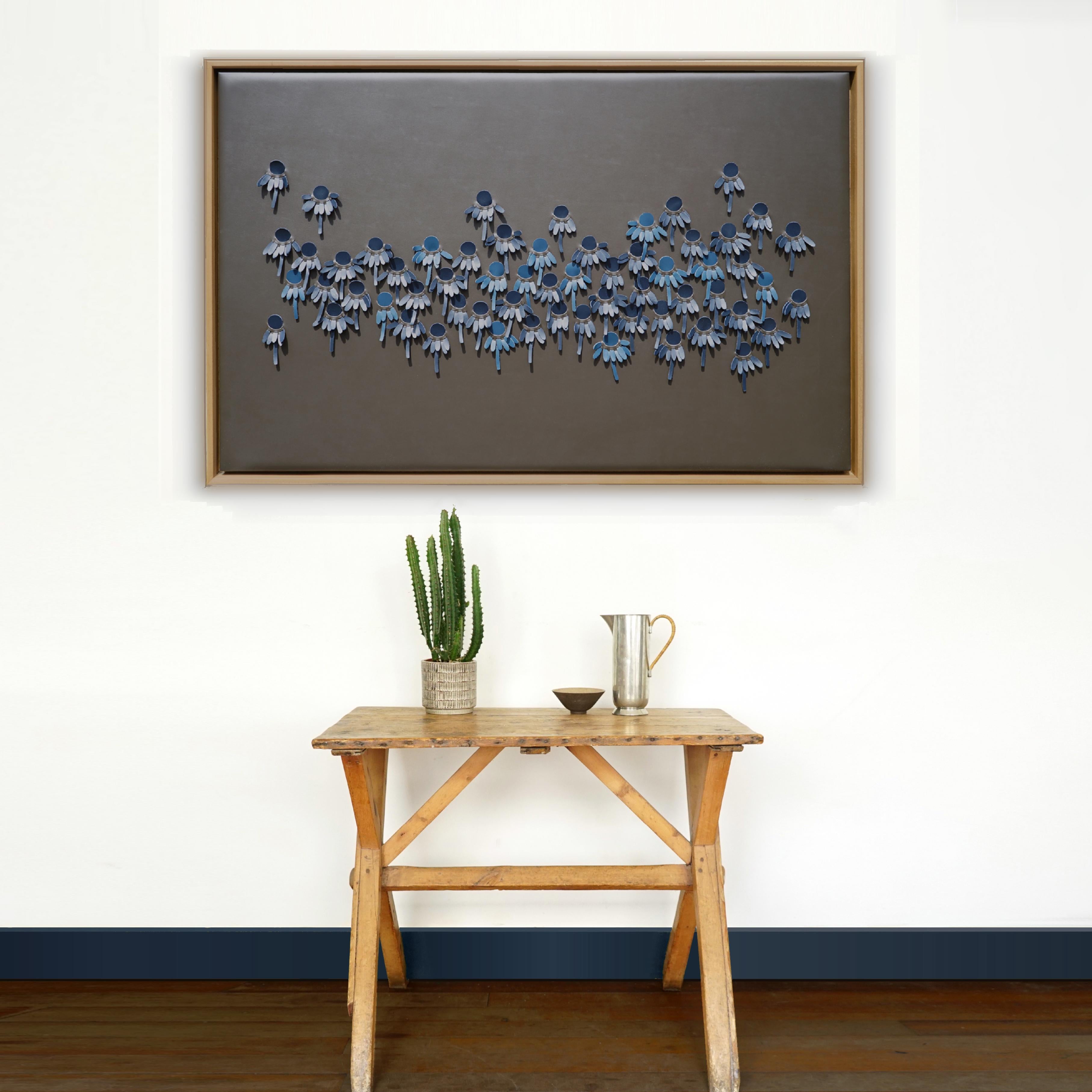 Coneflower:

A piece of 3D sculptural wall art designed and made from two layers of leather, one blue one pink, woven together by Louise Heighes.
Measurements are 31 x 49 inches or 79 x 124 cm

This piece of wall art is inspired by the slightly