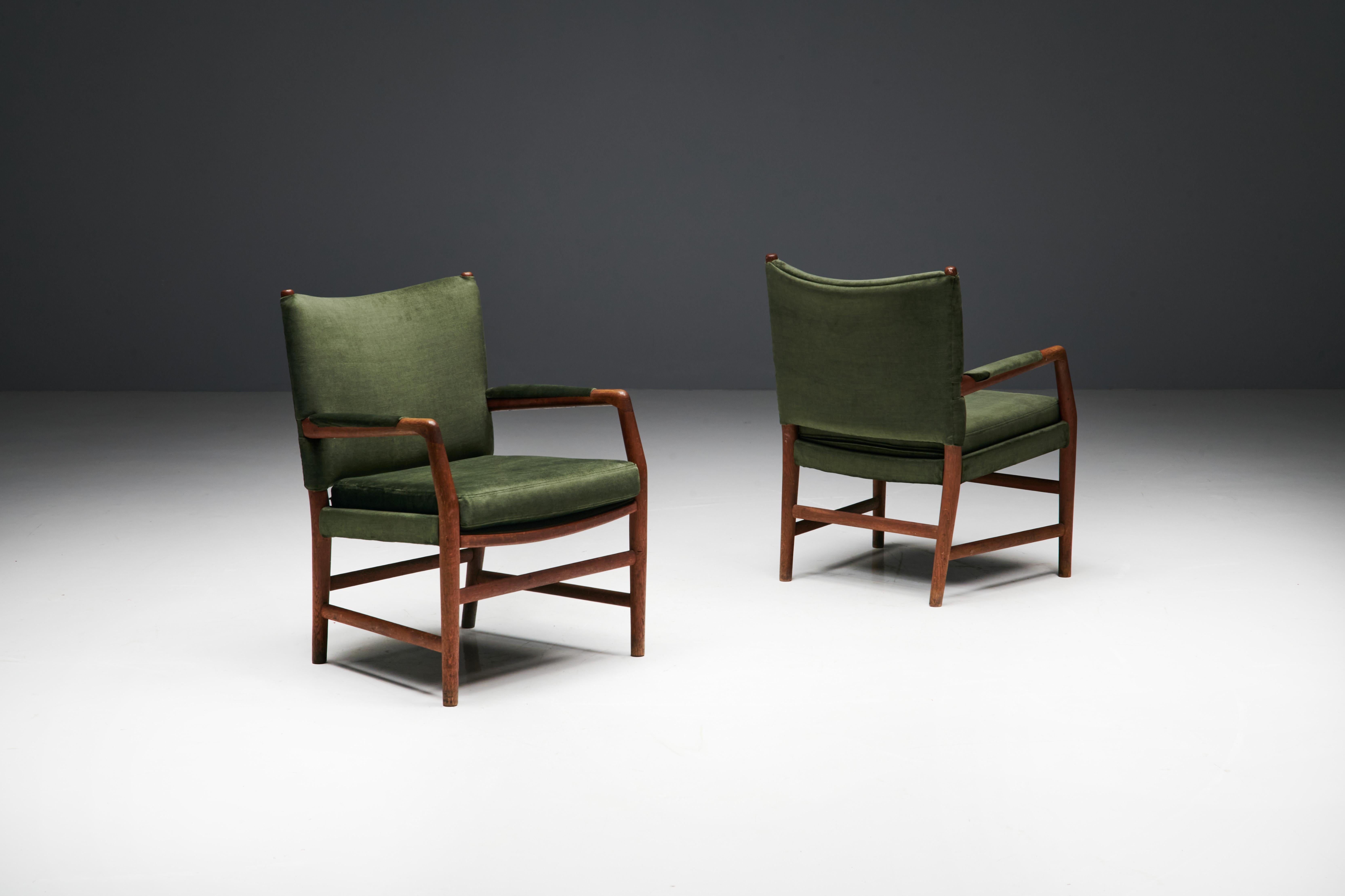 Conference chairs designed by Hans J. Wegner in 1942 for Plan Møbler, Denmark. These distinguished pieces, born from Wegner's creative genius, were originally designed for the Aarhus City Hall, a testament to their regal heritage. Each armchair