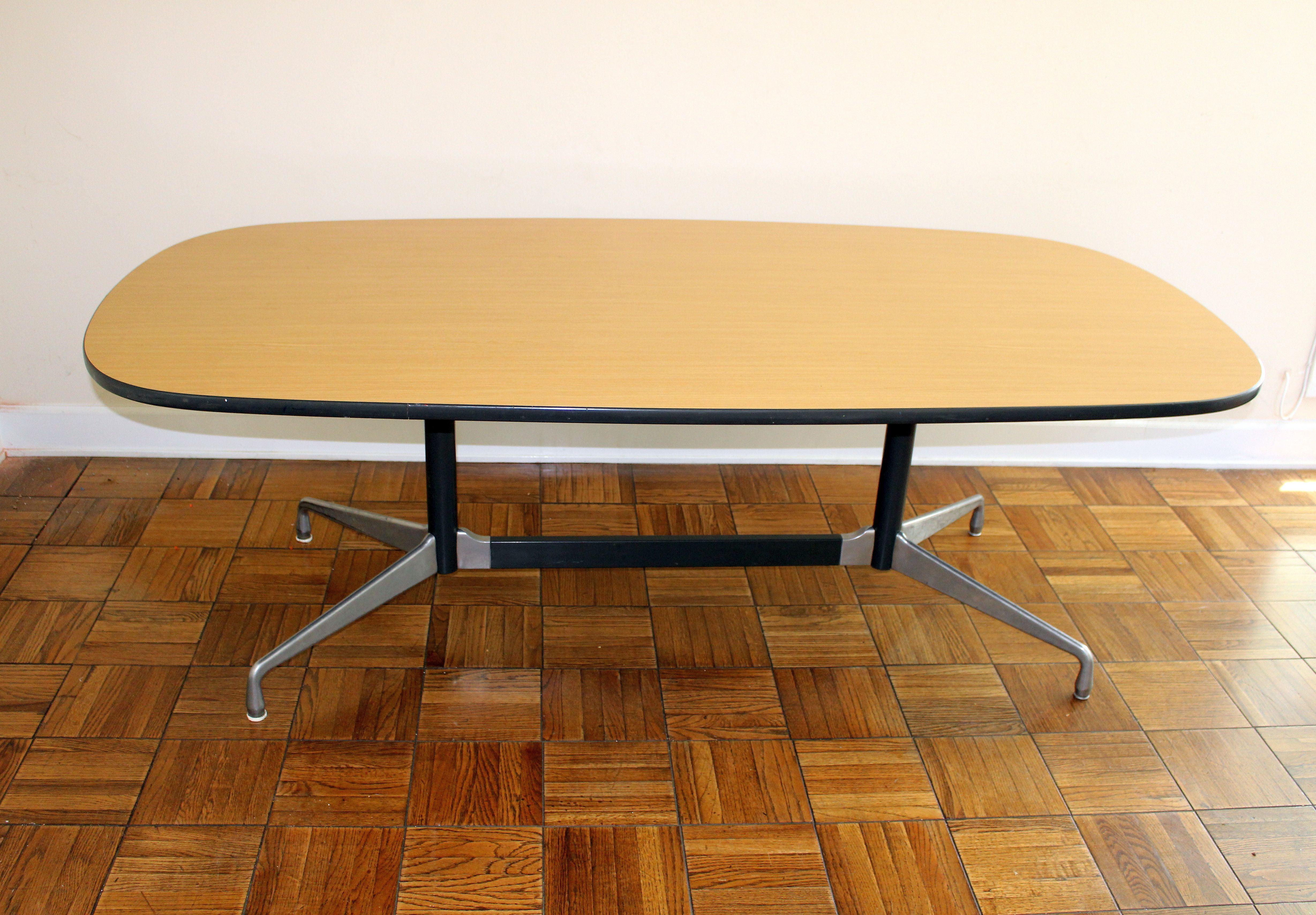 Formica tabletop aluminum base it can be use as a dining room or conference table .