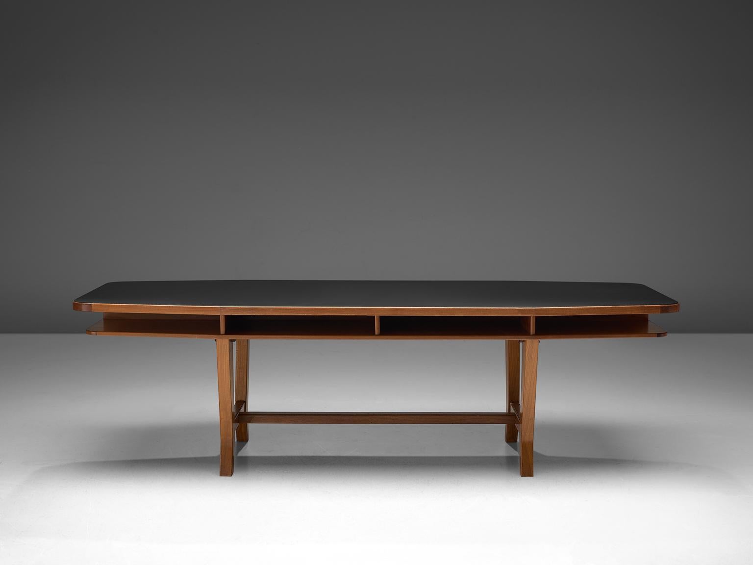 Dining table, teak and walnut, Germany, 1960s

Well designed rectangular-hexagon dining-/conference table with double top and robust yet elegant shaped legs. The black lacquered top has a modest and formal appearance, which combines very well with