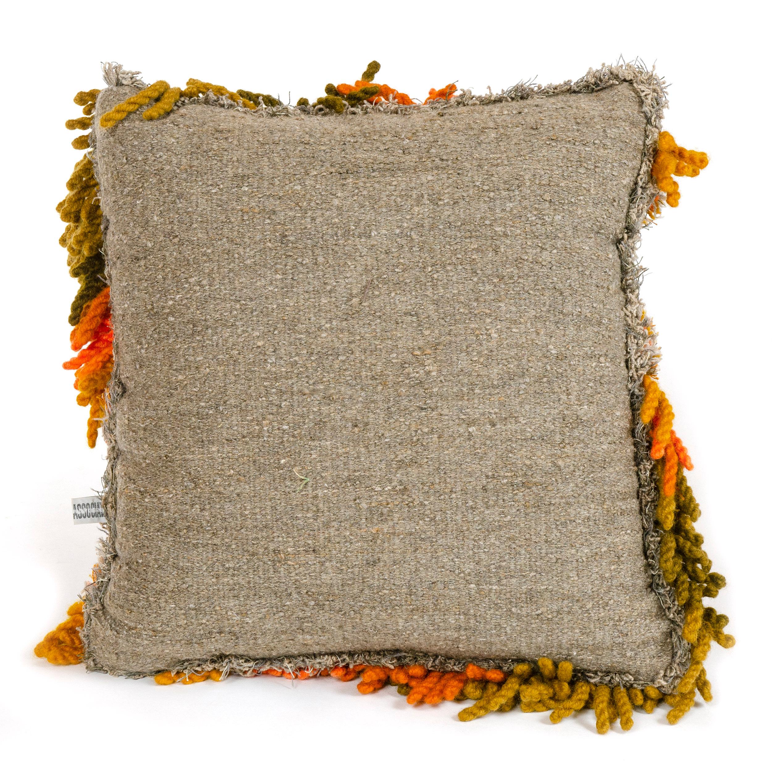 An original handwoven confetti pillow by Robert L. Kidd made with twist yarns of varied color, thickness and length. This pillow was likely displayed at Robert Kidd Gallery, which Kidd co-founded with fellow Cranbrook Academy of Art classmate Ray
