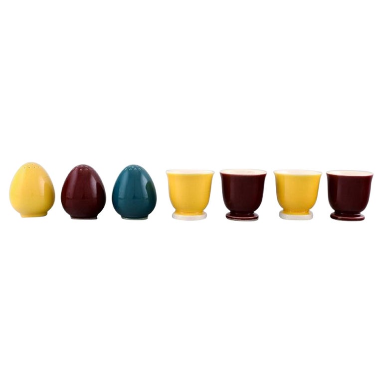 https://a.1stdibscdn.com/confetti-royal-copenhagen-aluminum-faience-three-salt-shakers-four-egg-cups-for-sale/1121189/f_173865021577716919921/17386502_master.jpg?width=768