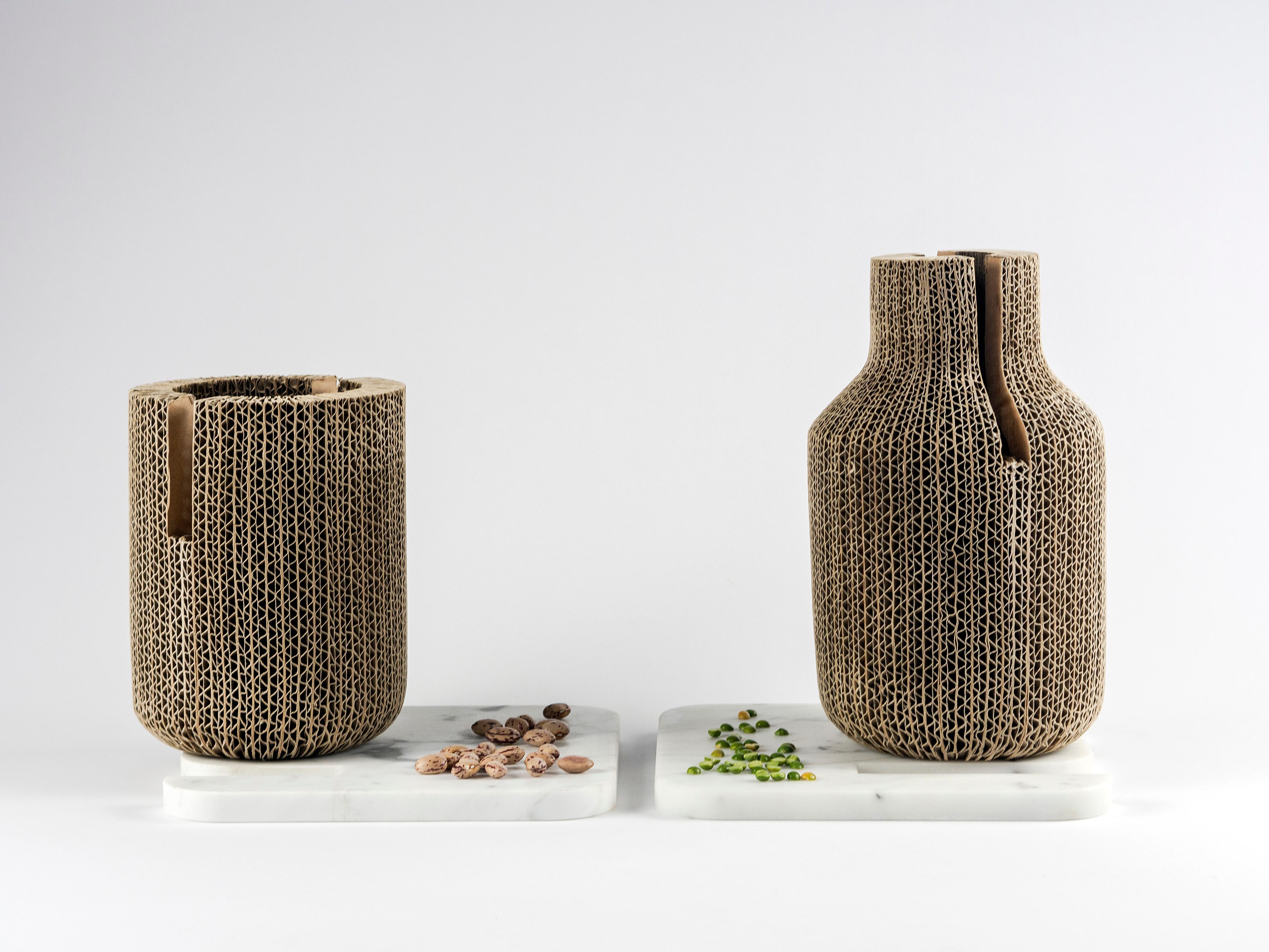 Vases material boundaries authenticate each other. Circumscribed forms, complementary to the identity of becoming. A collection of four vases that connect opposing materials: marble and cardboard. Light and heavy, solid and fragile, unalterable and