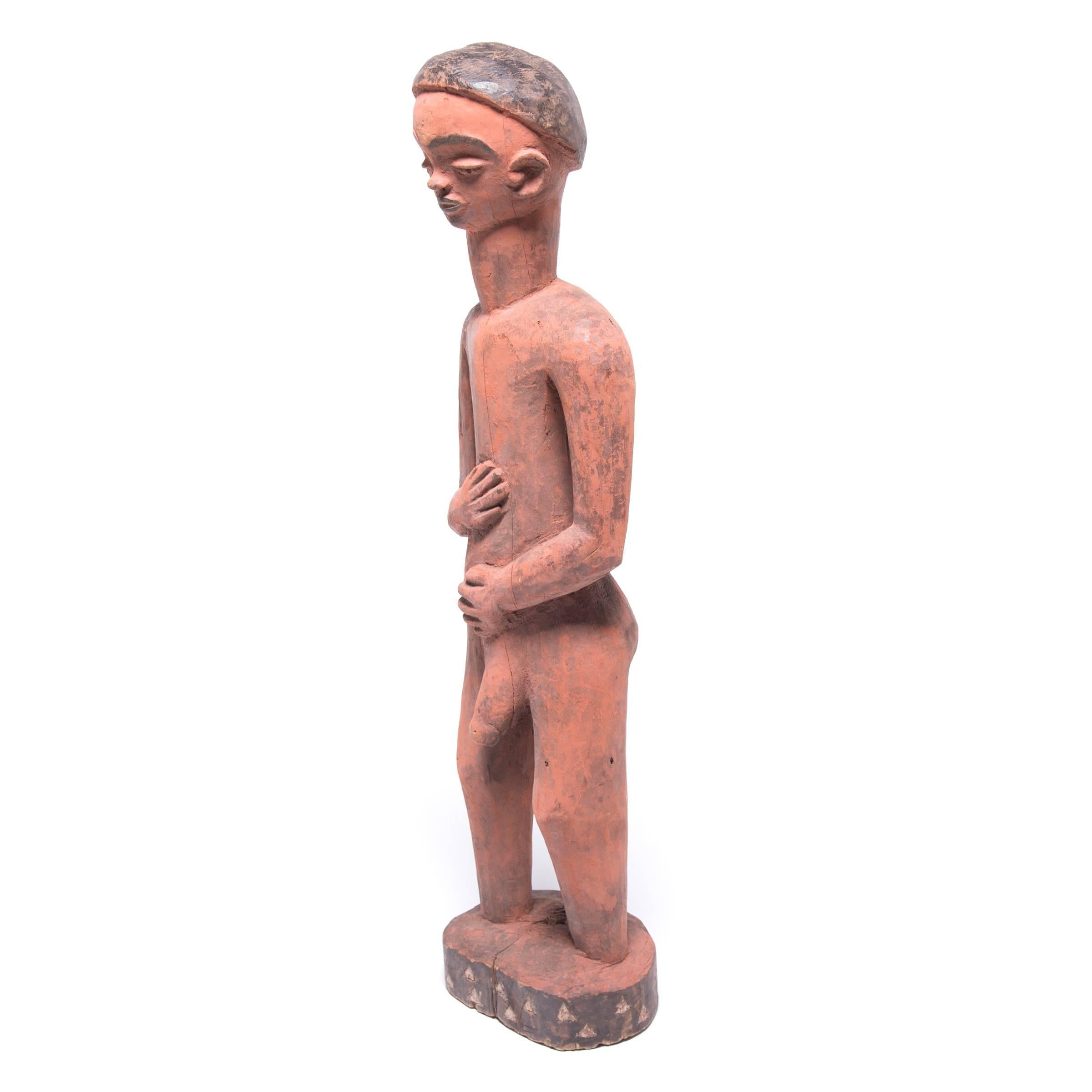 Pende diviners interpreted messages from the spirit realm to determine which of their ancestors would provide aid in return for sacrifices. This figure would have been carved for the recipient of such favors. The down-turned gaze and gently placed