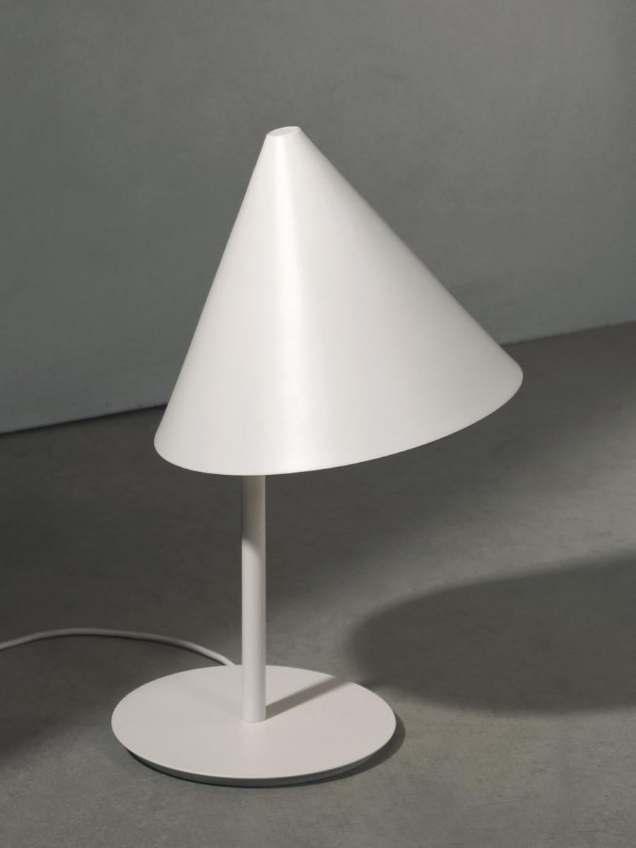 Practical, yet friendly and playful. Through an exploration of geometry and asymmetry, the Conic lamp from the bright talent of Thomas Bentzen sports a cone-shaped shade in painted metal, cocked at a pleasingly jaunty angle. Thomas Bentzen's work