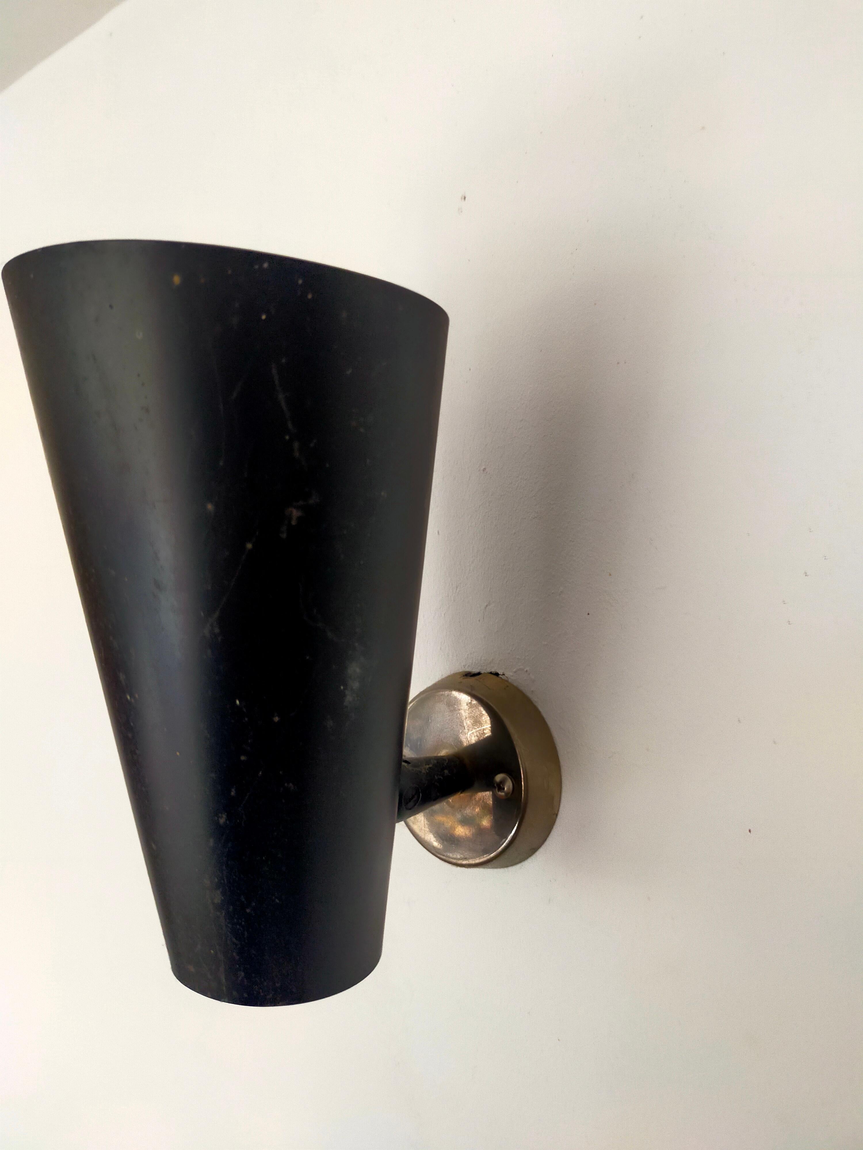 Conical black lacquered metal sconce by French manufacturer Lita.
Ball joint, reminiscent of Mouille's work with brass base.
Four pieces available.