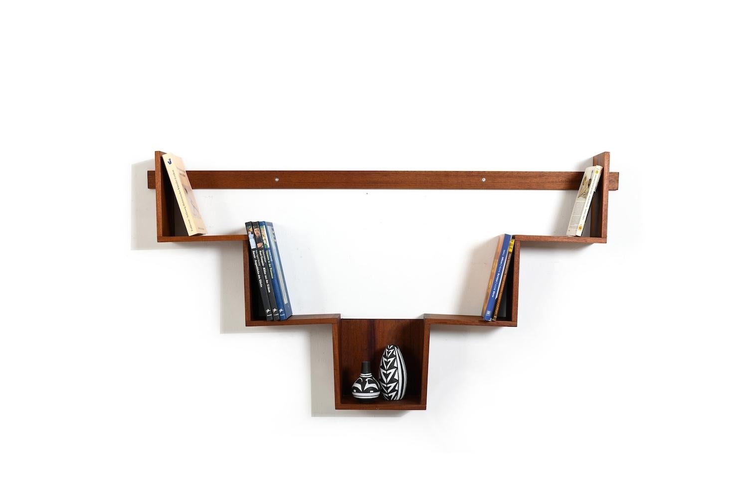 Conical shaped Danish book shelf 1960s in solid teak. Very good quality, in solid teak. Denmark 1960s.