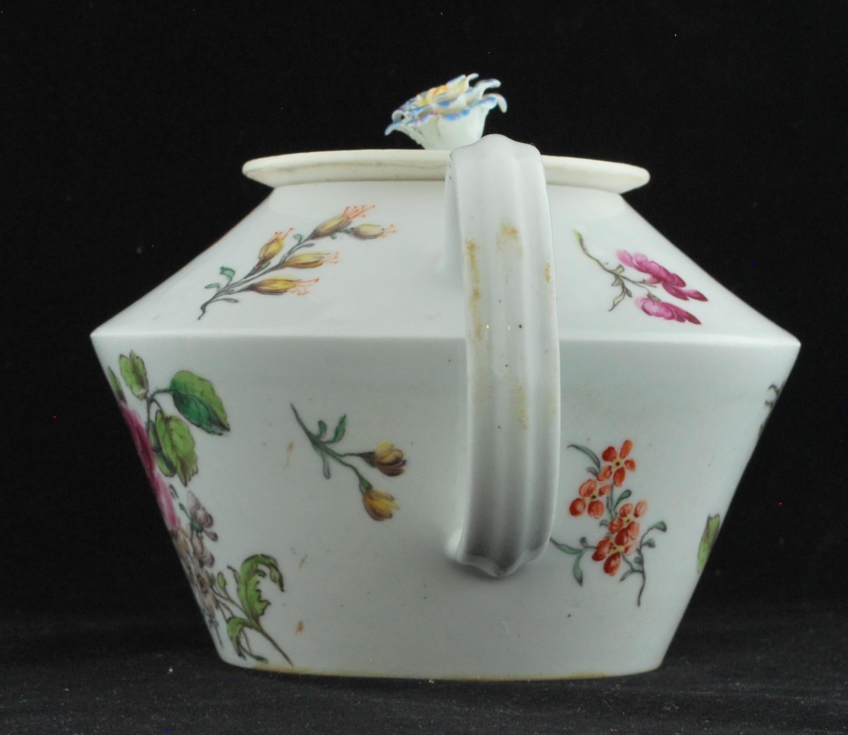 An unusual shape, which looks impractical and yet the lid is surprisingly stable when the pot is tilted. The usual superb flower painting for this period.

See McKenna, Red Anchor Wares, item 31 for another of similar form.