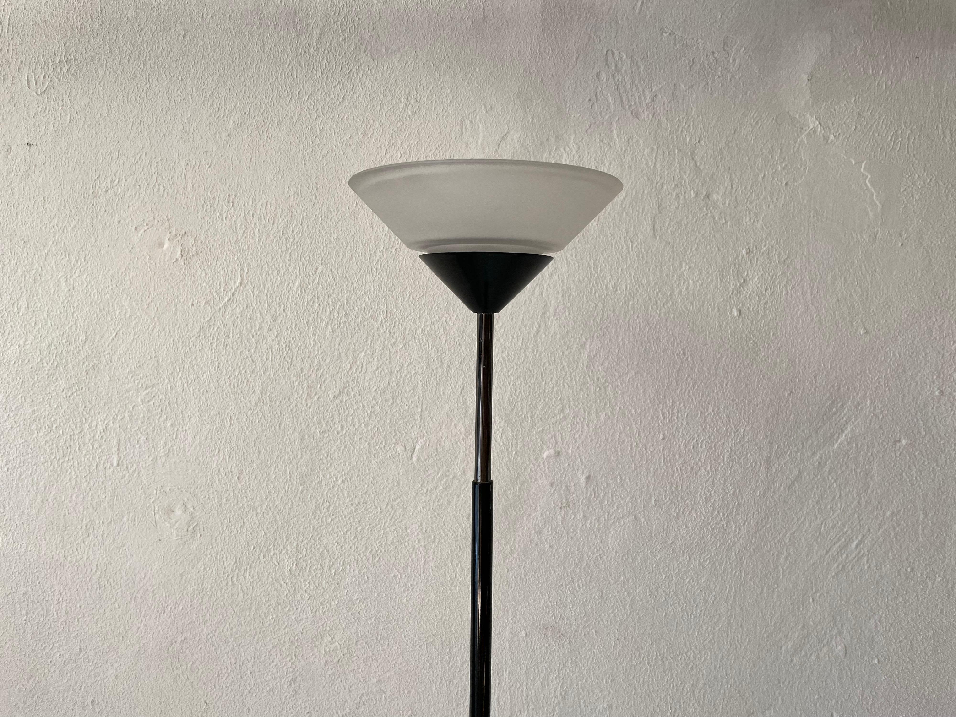 Conical glass and black metal floor lamp by Tronconi, 1970s, Italy

Lamp is in very good vintage condition.

*Lamp has a two-stage light function.

This lamp works with Halogen light bulb. 
Wired and suitable to use with 220V and 110V for all