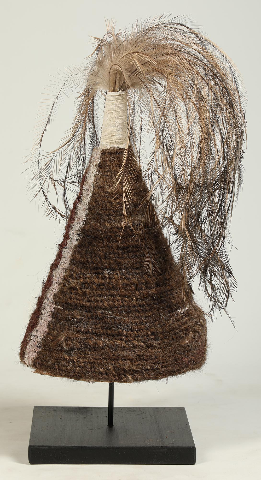 Early to mid-20th century woven fiber and palm leaf conical hat with two vertical painted stripes on the front, from Mornigton Island, Queensland, Australia.
Measures: 16 inches high, on custom wood base, total height 20 inches.
  