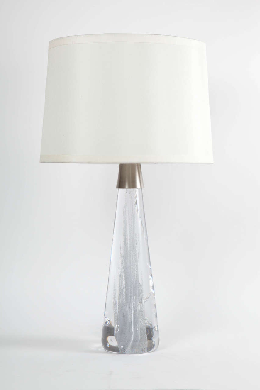 Swedish Modern pair of conical shaped glass lamps with internal bubble inclusions and satin nickel necks and sockets. Rewired with silver silk twist cord. Designed by Vicke Lindstrand for Kosta.
