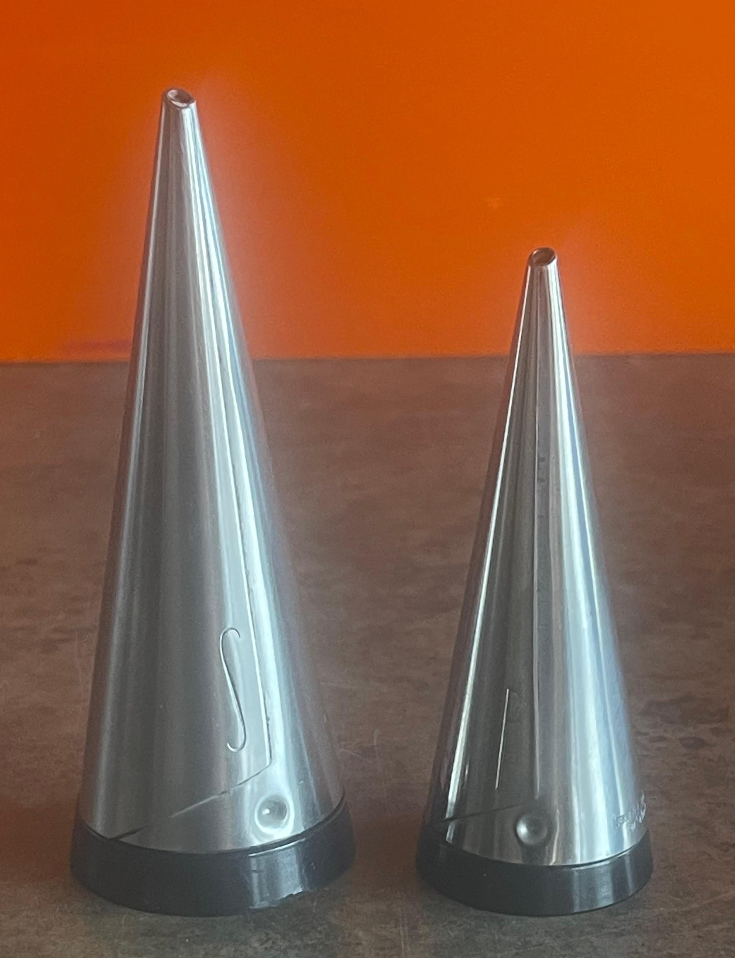 Stylish pair of vintage Scandinavian modern conical shaped salt and pepper shakers by Pierre Forssell for Gense, circa 1960s. Timeless design in stainless steel and bakelite, the salt shaker is engraved with an 'S' and the pepper shaker with a 'P'.