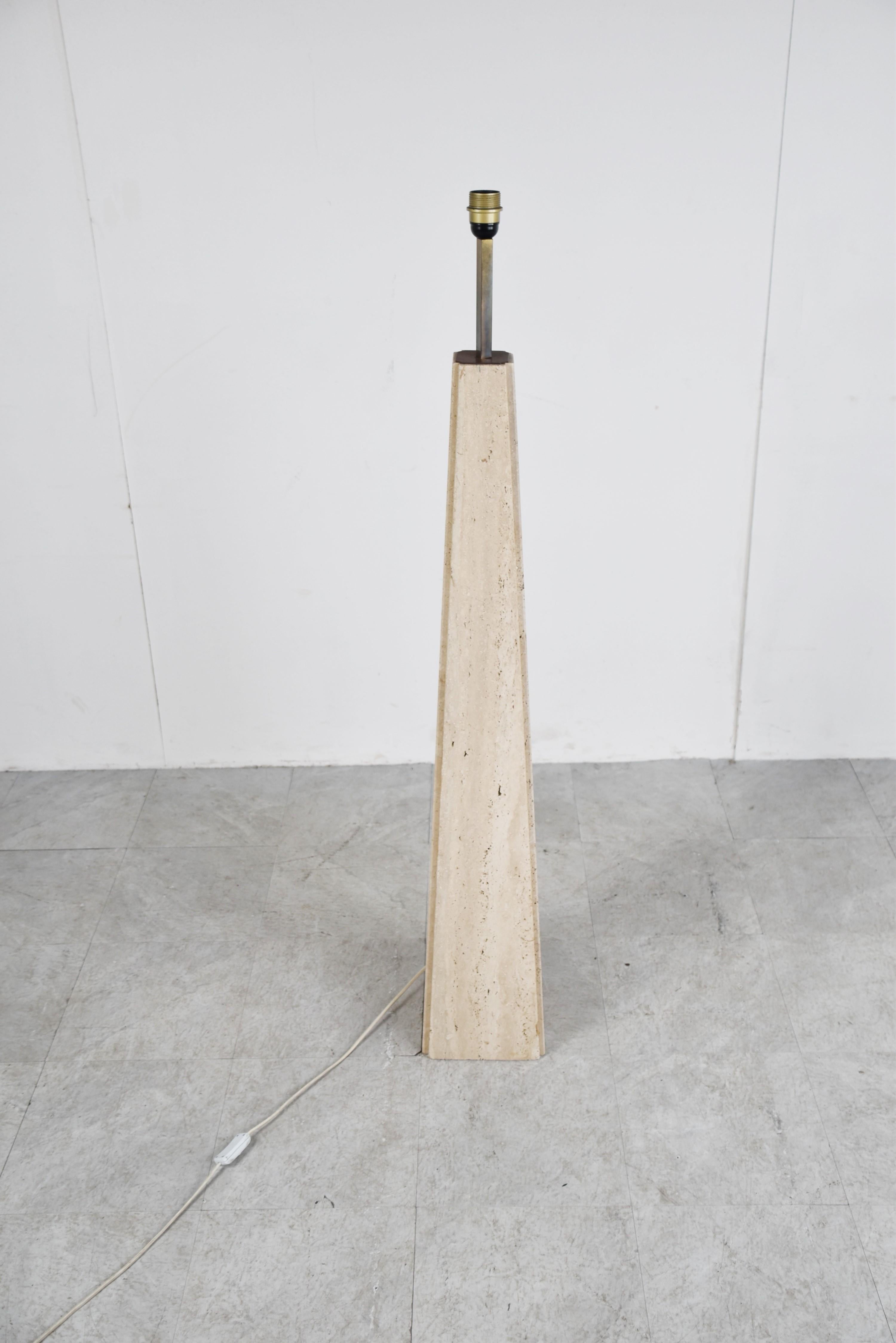 Beautiful conical travertine obelisk floor lam by Camille Breesch.

The floor lamp has a nice brass lamp/shade holder.

Timeless floor lamp.

Designed by Camille Breesch, we had table lamps from her with the same shape.

Here the name plate