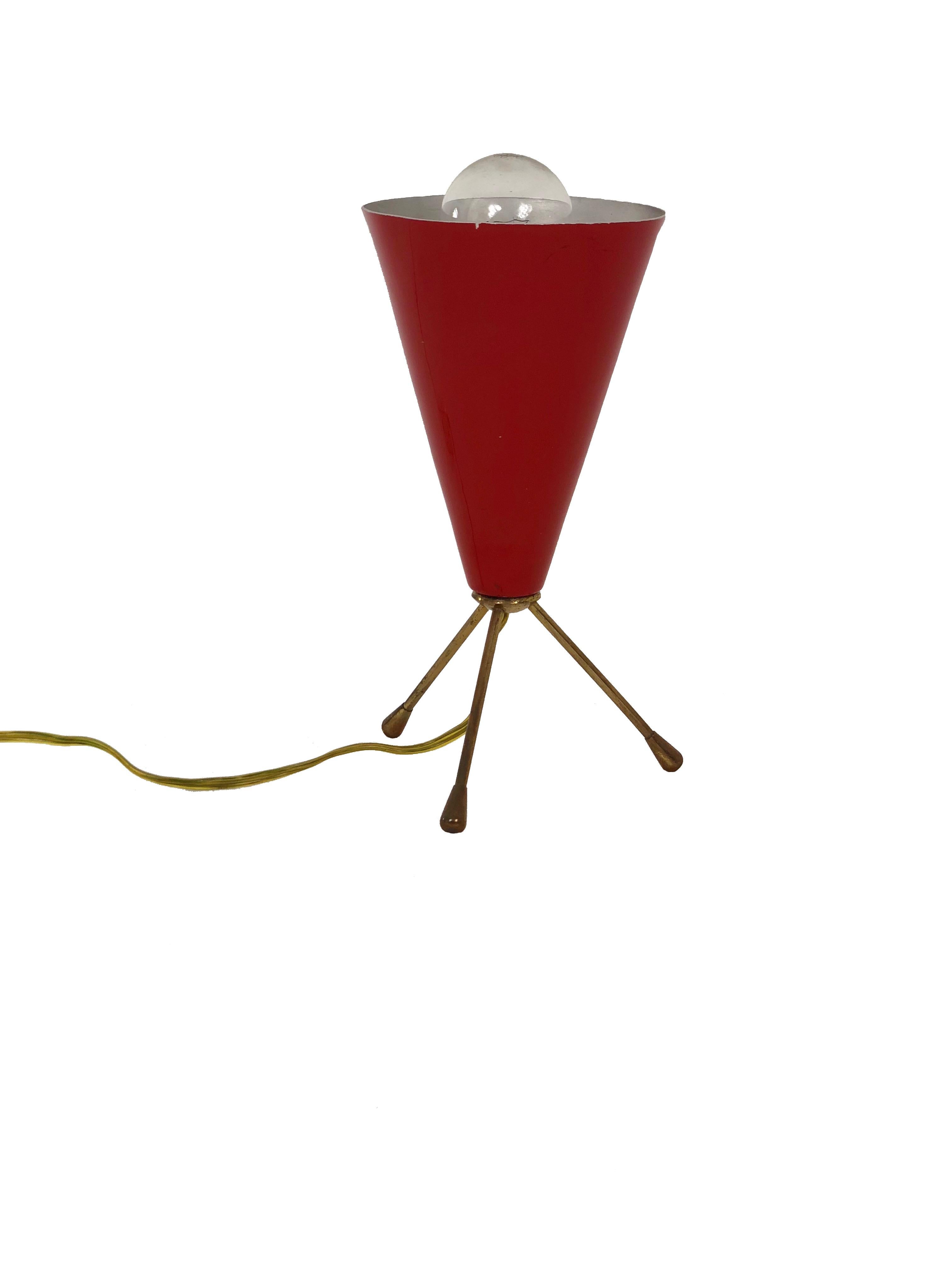 Petite Italian tripod cone shaped table lamp in brass and red lacquered metal.