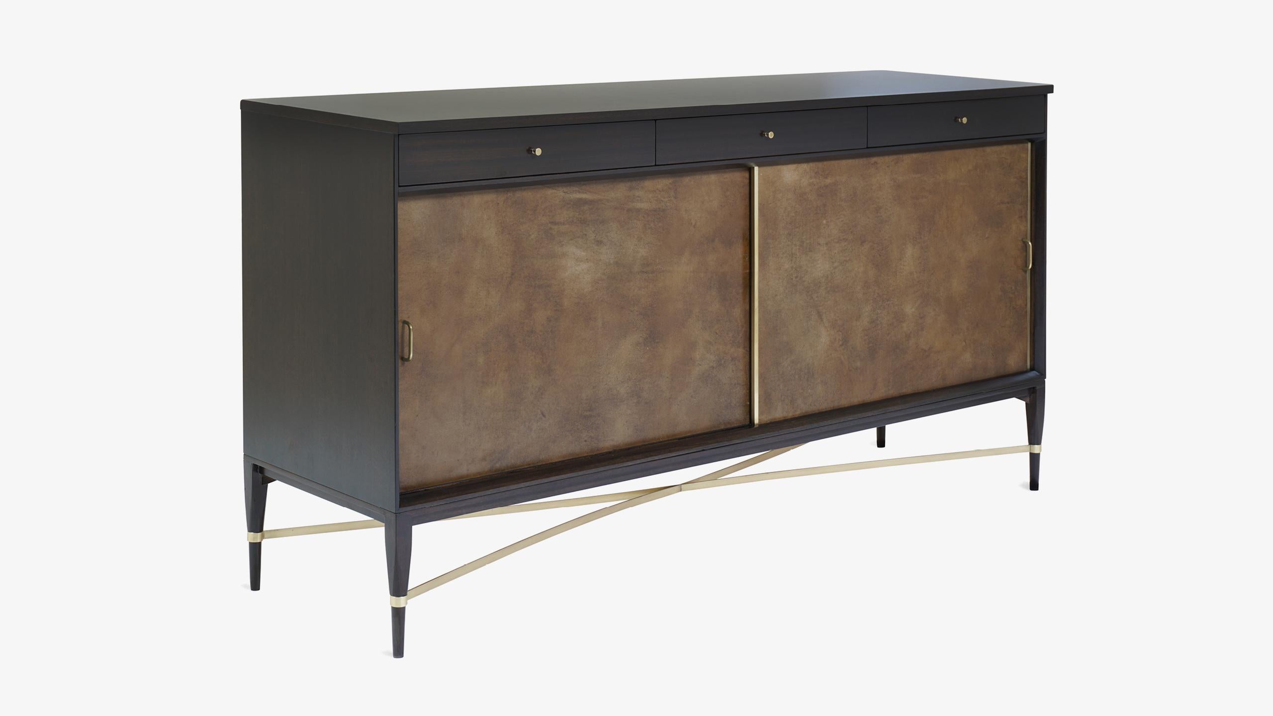 If there was a design piece that would be the ultimate identifier of Paul McCobb’s signature motif, it would undoubtedly be this “Connoisseur Collection” Sideboard designed for Calvin Group. McCobb’s mastery of gentle proportions is evident