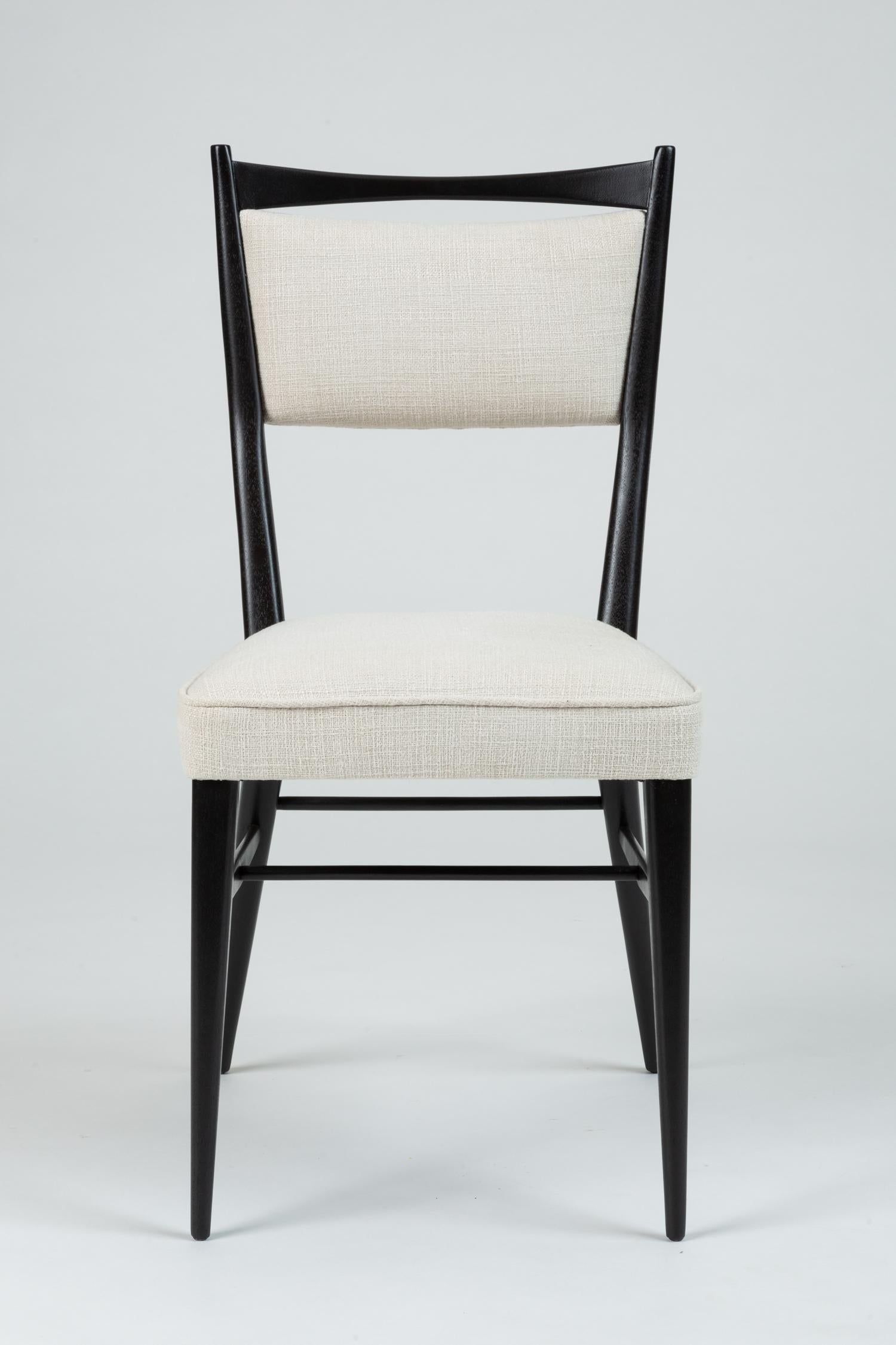 Classic American modernist lines are showcased in this single accent chair by Paul McCobb for H. Sacks and Sons. Designed as a dining chair for the 1953 Connoisseur Collection, the piece has an angular construction with a tapering backrest and