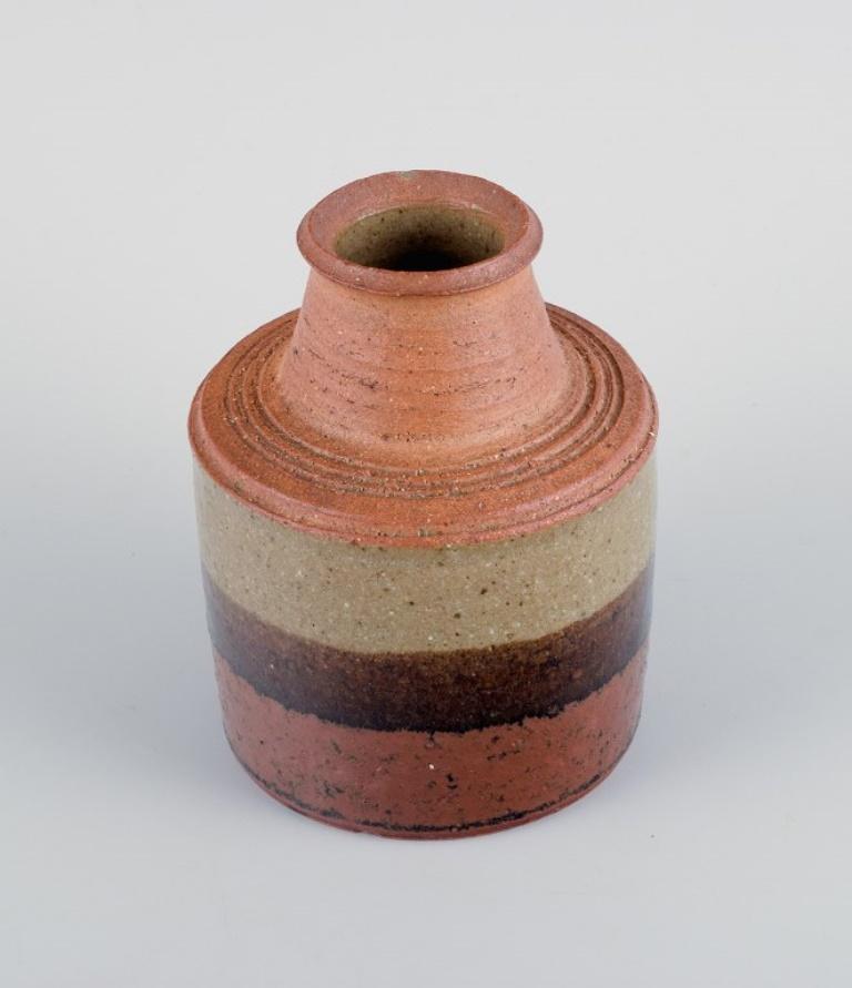 Conny Walther, Danish ceramicist and others.
Two ceramic vases and a candle holder for tealights.
1950s/60s.
In excellent condition, one vase with a minor chip on inside of top.
Marked.
Largest dimensions: H 13.0 cm x D 9.5 cm.