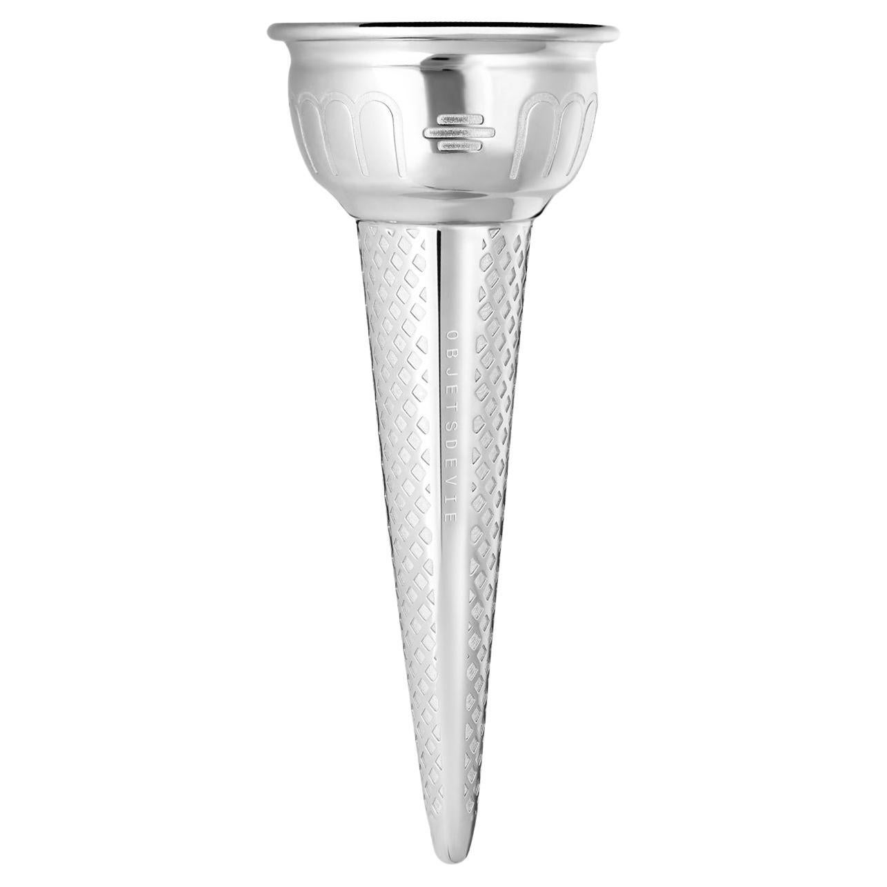 The Cono 925 is an engraved, antibacterial sterling silver ice cream cone: a nostalgic object reminiscent of summer holidays rendered precious and everlasting.